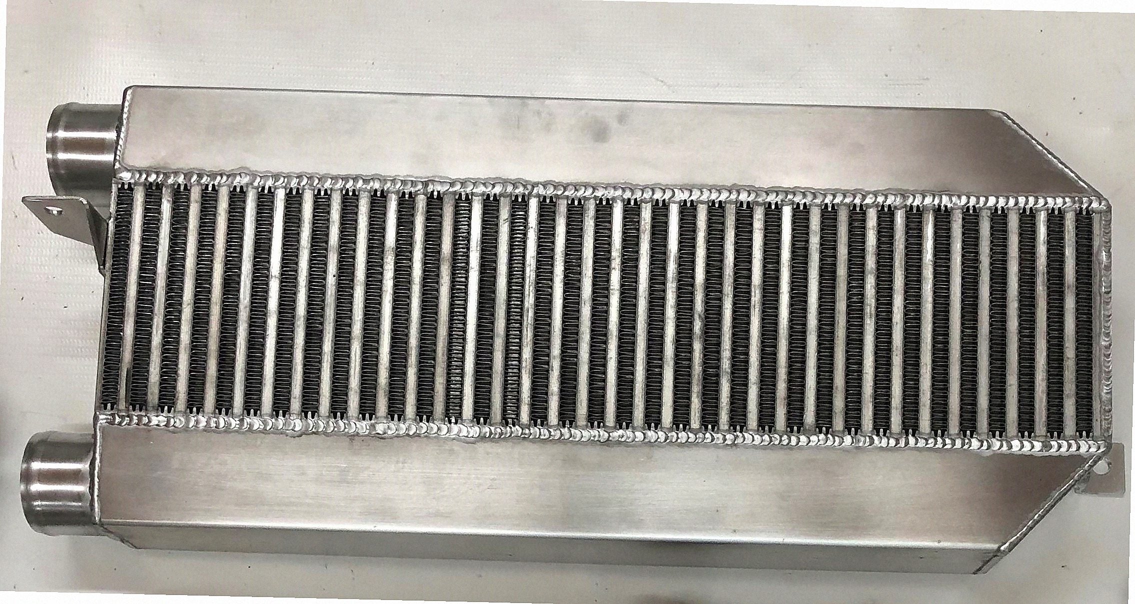 94/95 Turbo Intercooler 3" — fabricated aluminum bar-and-plate intercooler core with TIG-welded end tanks