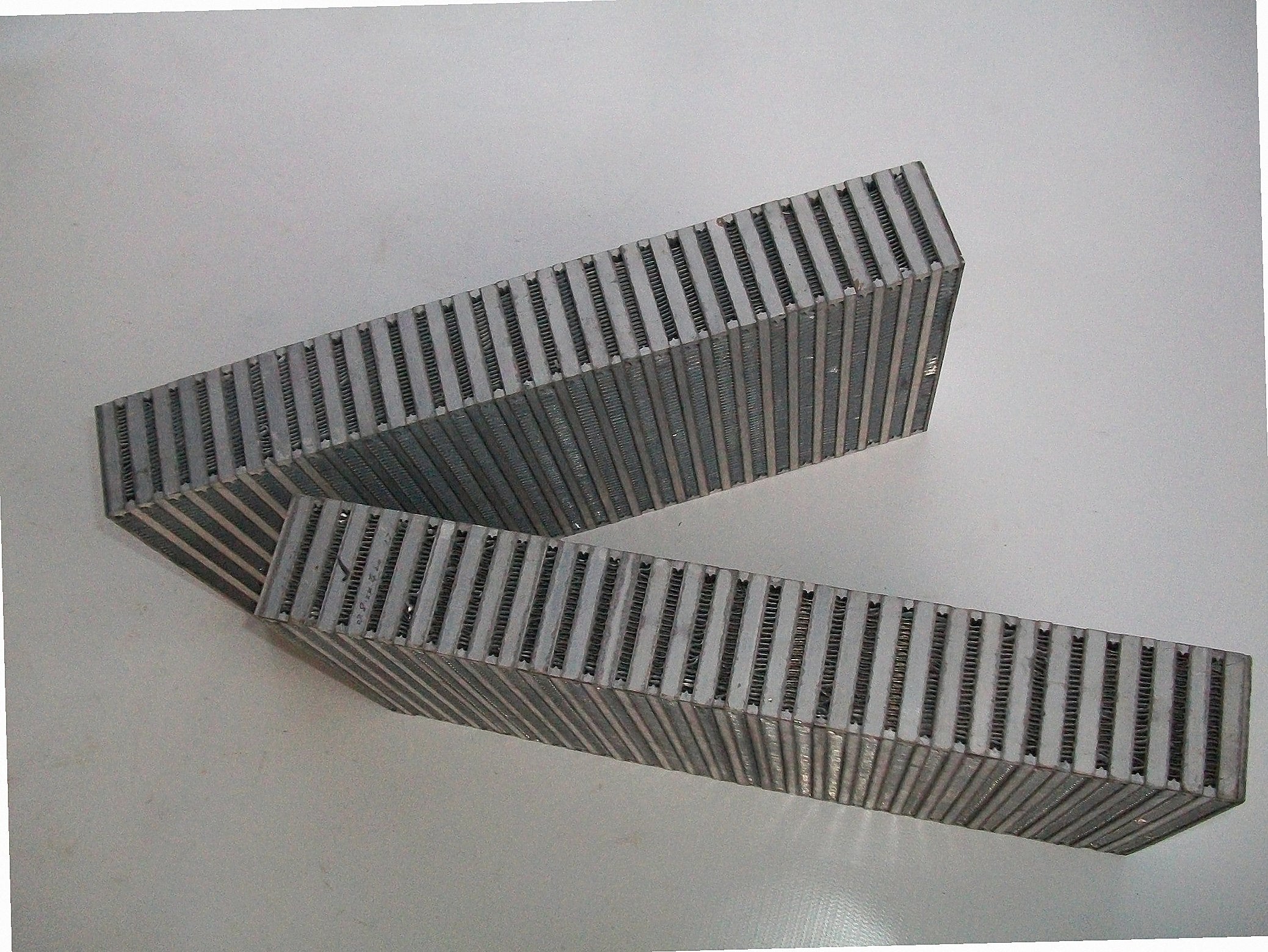 Custom Intercooler 1300 HP — intercooler core detail showing bar-and-plate fin density and TIG-welded seams