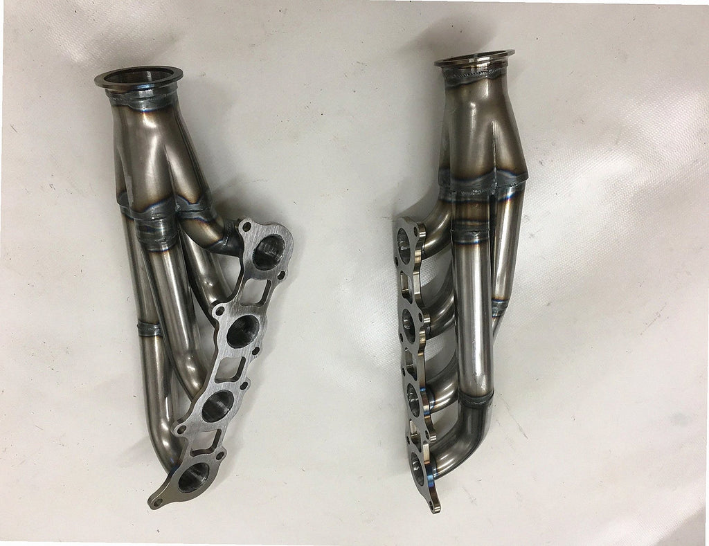 5.0 Coyote Headers — detail view of merge collector, flex bellow joint, and V-band connection