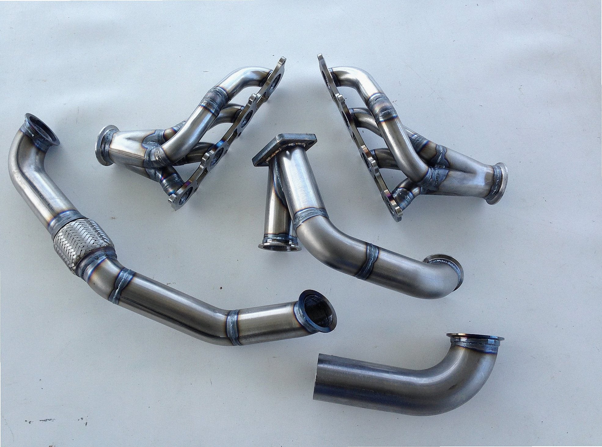 Coyote Turbo Swap Driver Side Street/Drag Kit — detail view of merge collector, flex bellow joint, and V-band connection