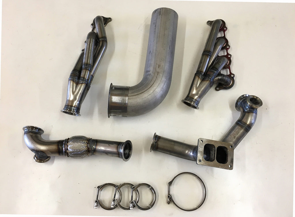 5.0 Coyote 15-18 TO6 Turbo Race Kit — complete turbo hot-side kit with mild steel tubular headers, crossover pipe with flex bellow, starter downpipe, and turbo mount flange