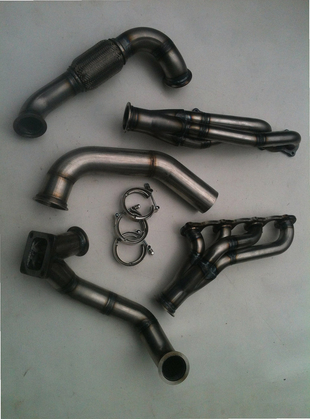 Lightning Turbo Race Kit — complete turbo hot-side kit with mild steel tubular headers, crossover pipe with flex bellow, starter downpipe, and turbo mount flange