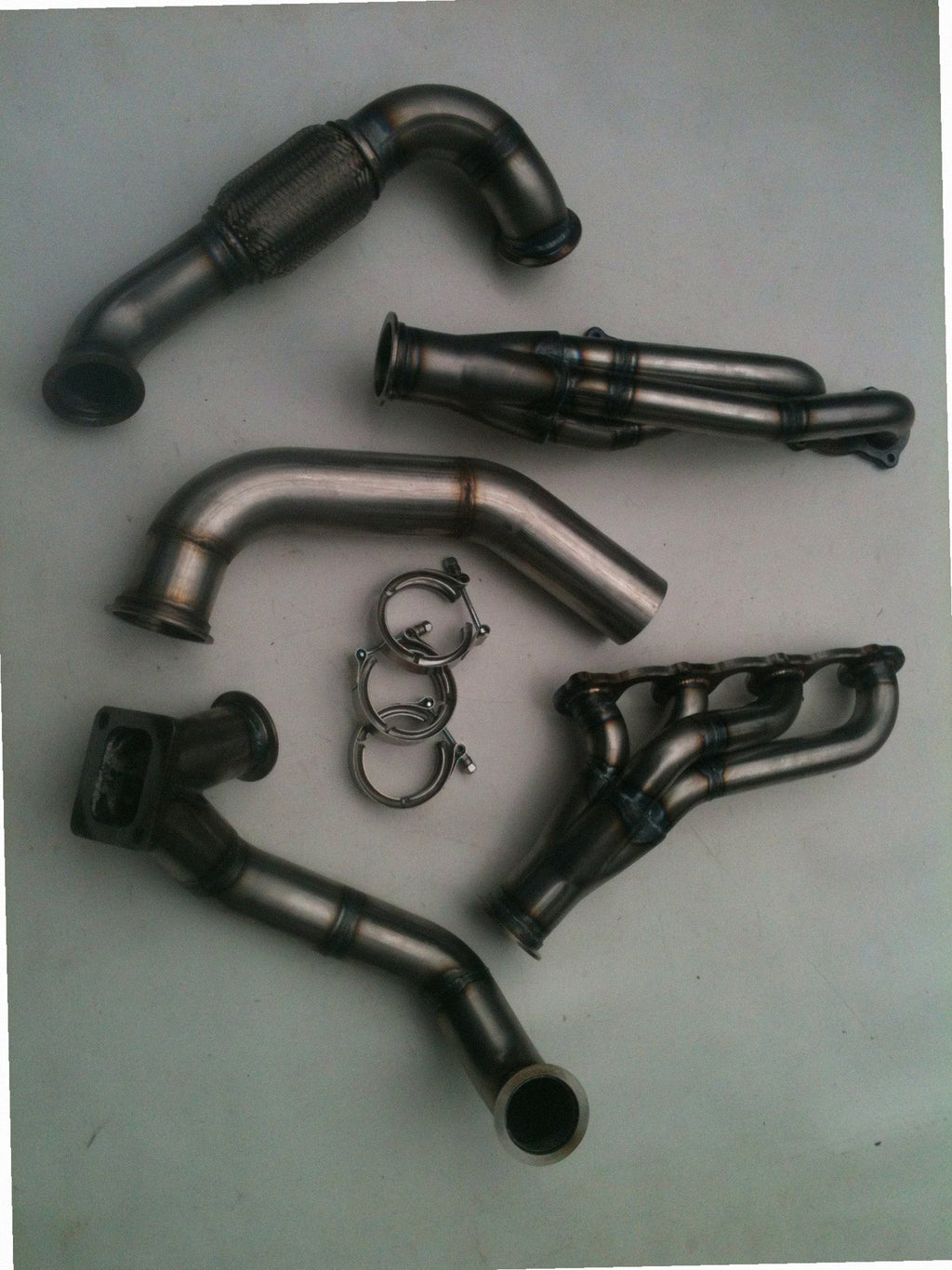 Lightning Turbo Race Kit — passenger-side header with V-band flange and merge collector