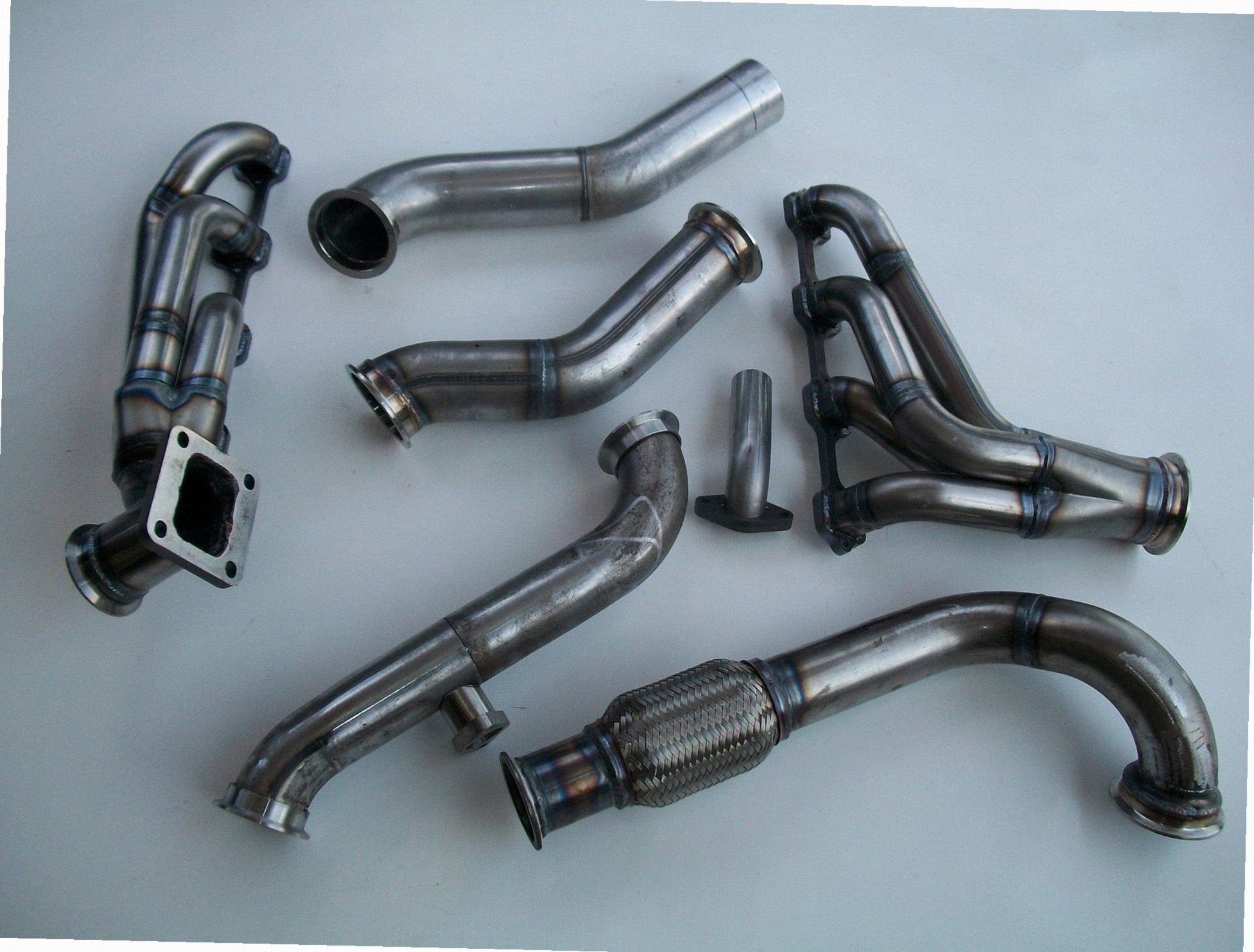 5.0 Mustang Turbo Kit — detail of crossover pipe, flex bellow, or starter downpipe
