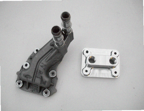 5.4 Water Inlet / Outlet — billet aluminum water inlet/outlet plate with 1/2 NPT ports for intercooler coolant lines