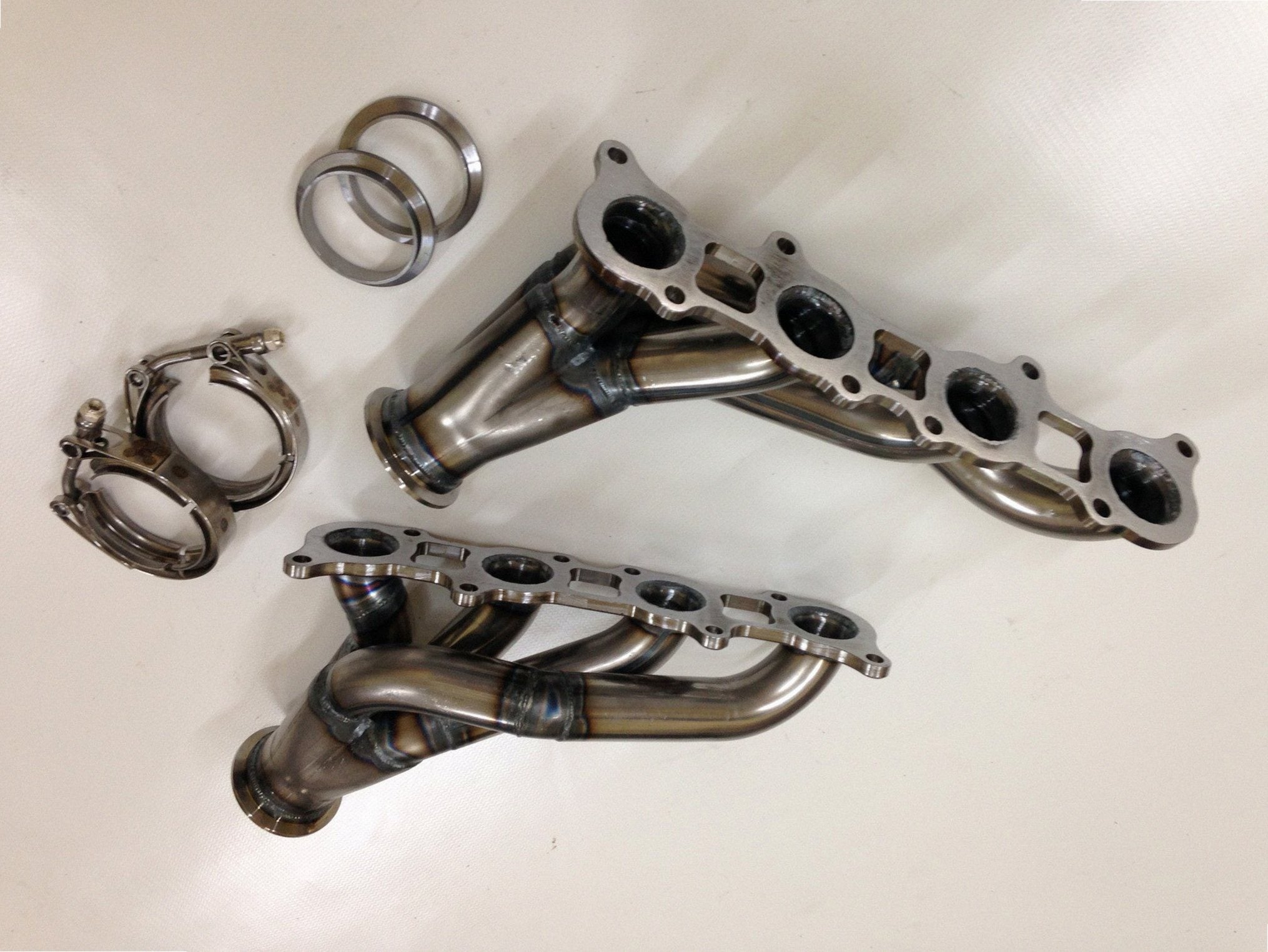 Coyote Swap Turbo Headers — detail view of merge collector, flex bellow joint, and V-band connection