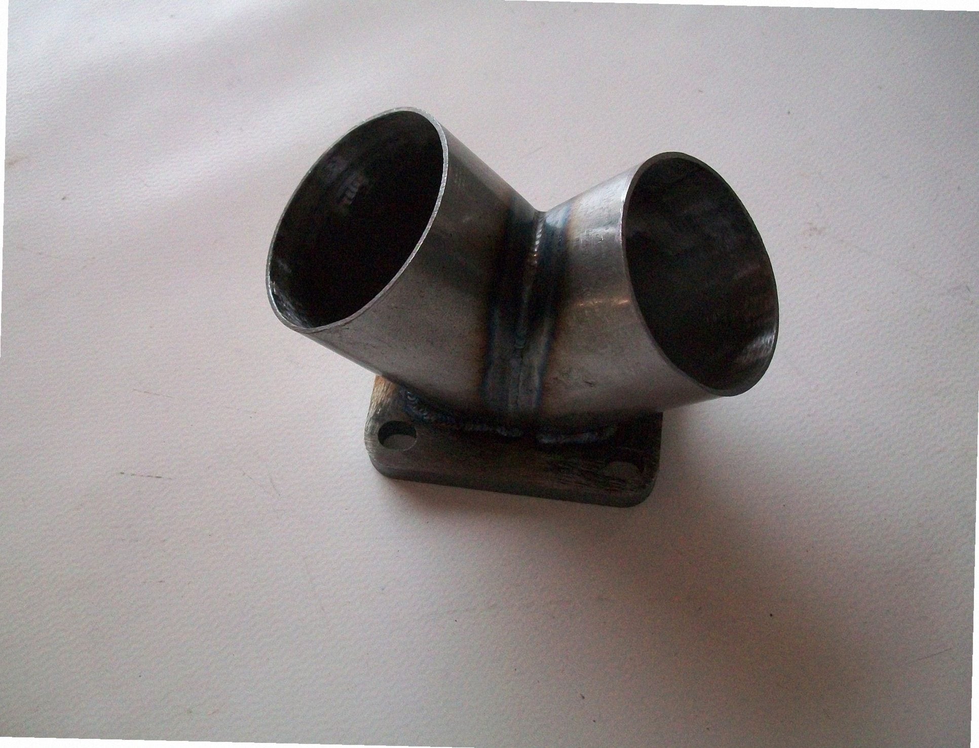 TO6 Turbo Mount Flange — CNC-machined stainless steel turbine inlet flange, multi-axis milled for turbocharger fitment