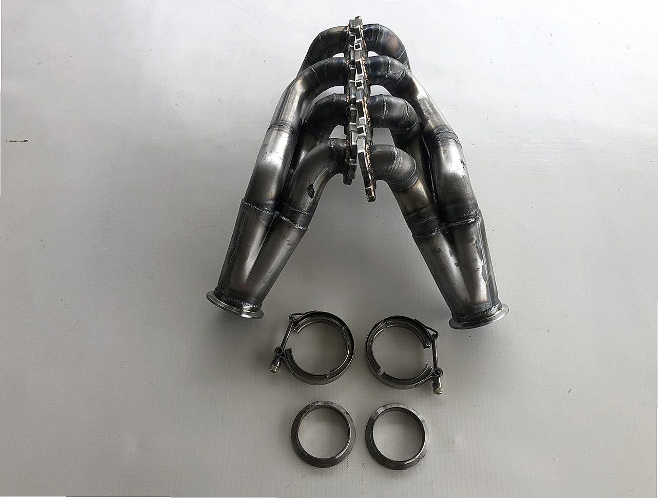 7.3 Godzilla Swap Turbo Headers — detail view of merge collector, flex bellow joint, and V-band connection