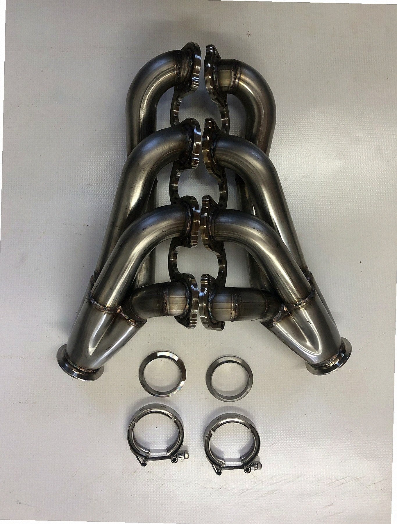 Small Block Ford Motor Plate Turbo Headers — detail view of merge collector, flex bellow joint, and V-band connection