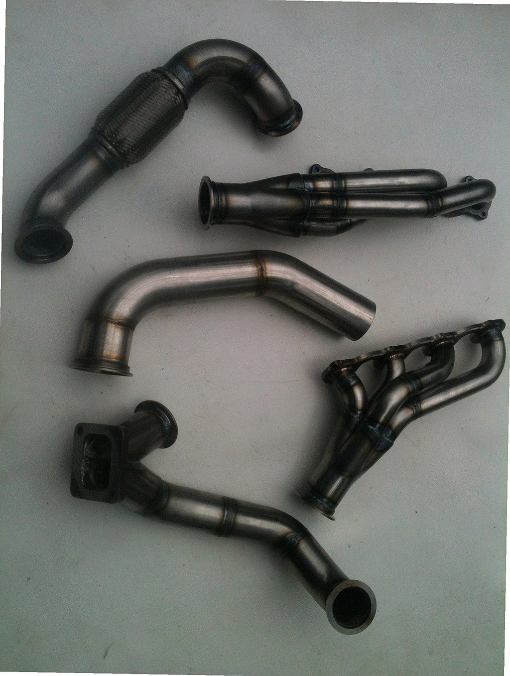 Lightning Turbo Race Kit — detail view of merge collector, flex bellow joint, and V-band connection