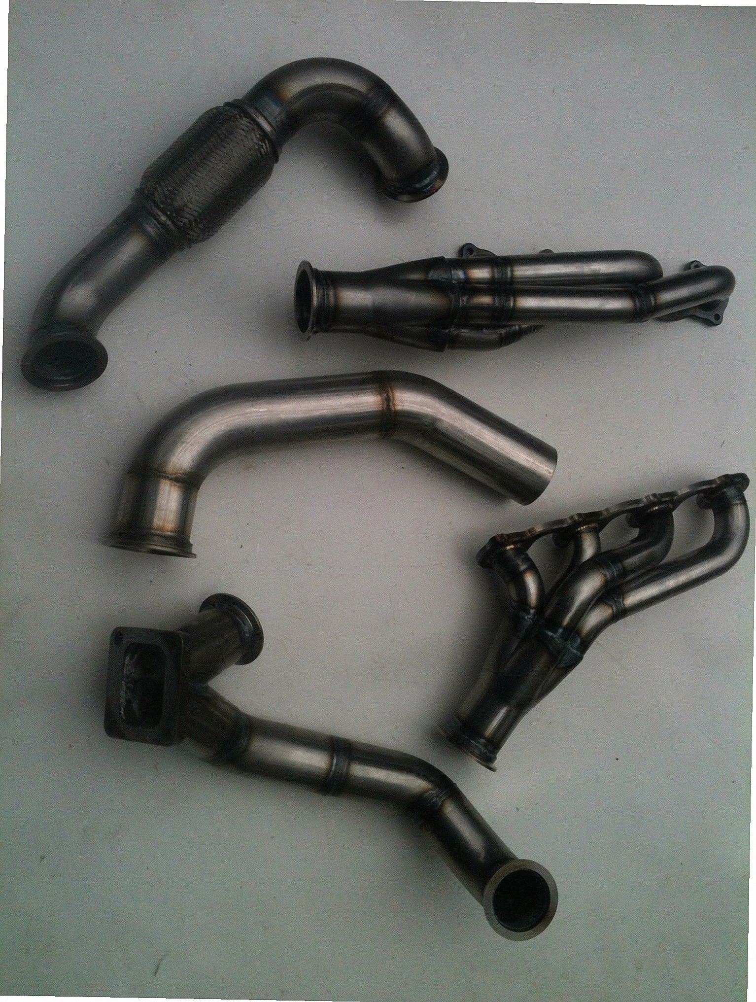 Lightning Turbo Race Kit — detail view of merge collector, flex bellow joint, and V-band connection