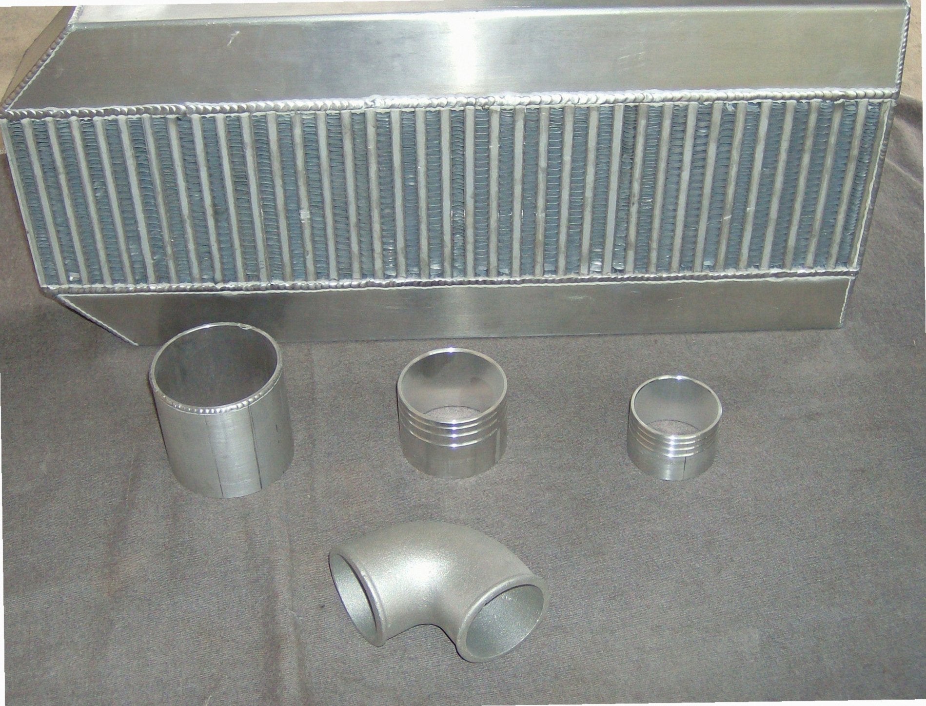 Custom Air-to-Air IC 3" — detail view of merge collector, flex bellow joint, and V-band connection