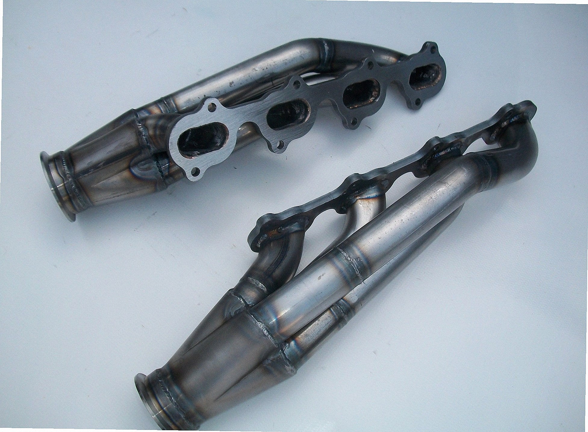4.6 4V Modular / Fox Body Headers — detail view of merge collector, flex bellow joint, and V-band connection