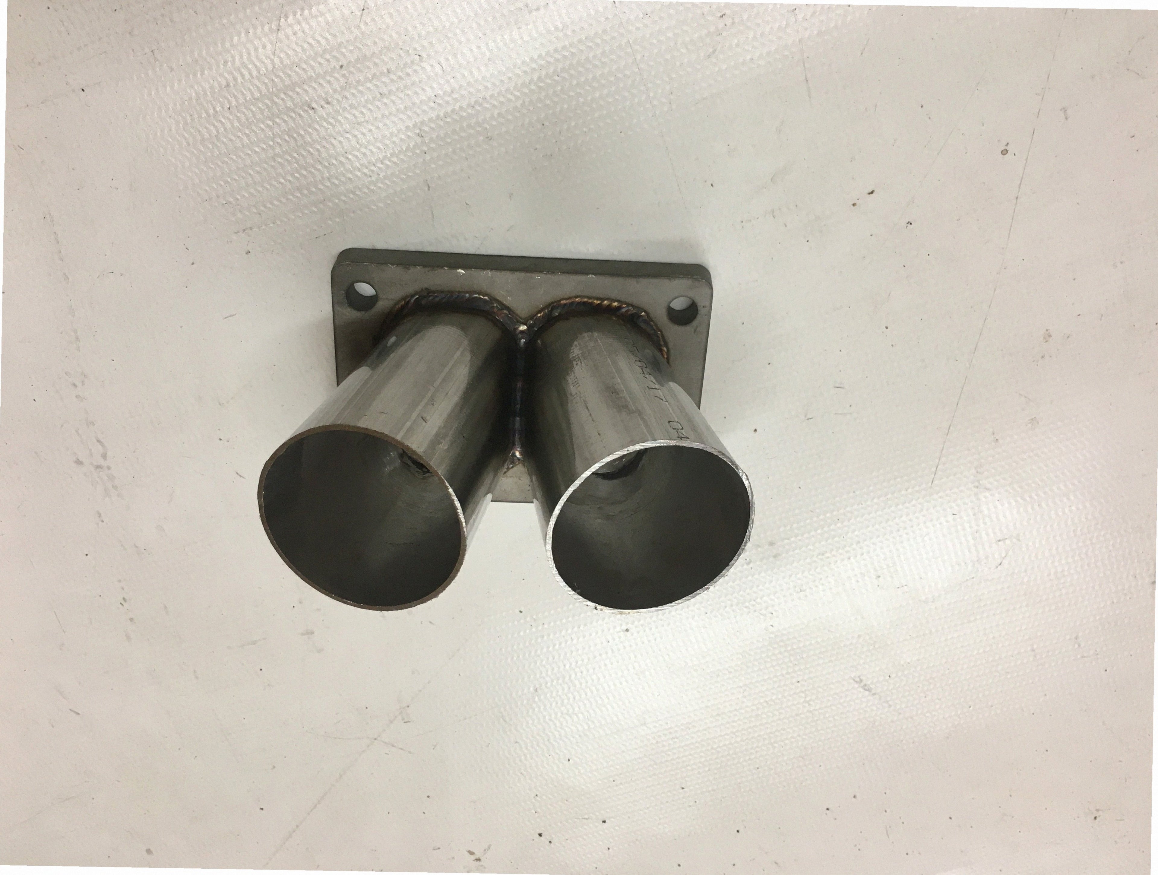 TO6 Divided Turbo Mount Flange — alternate angle showing flange thickness, bolt pattern, and weld bevel