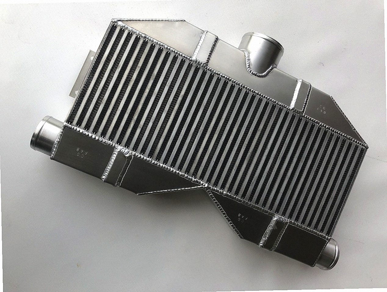 Twin Turbo Intercooler 1600 HP — TIG-welded aluminum end tank with charge pipe stubs