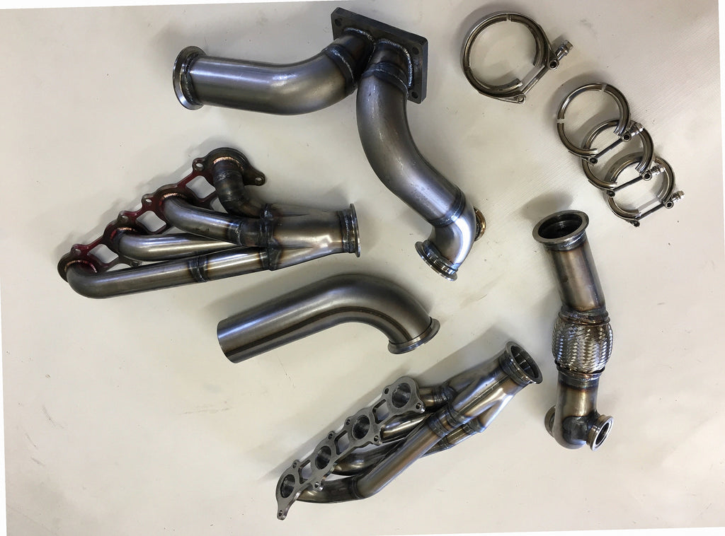 5.0 Coyote 10-14 TO4 Turbo Street/Drag Kit — detail view of merge collector, flex bellow joint, and V-band connection