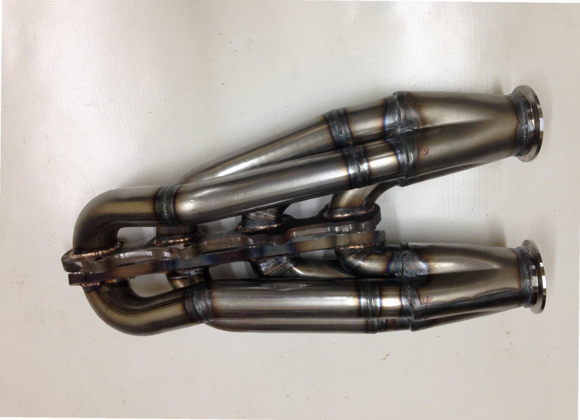 5.4 4V Facing Forward Headers — passenger-side header with V-band flange and merge collector