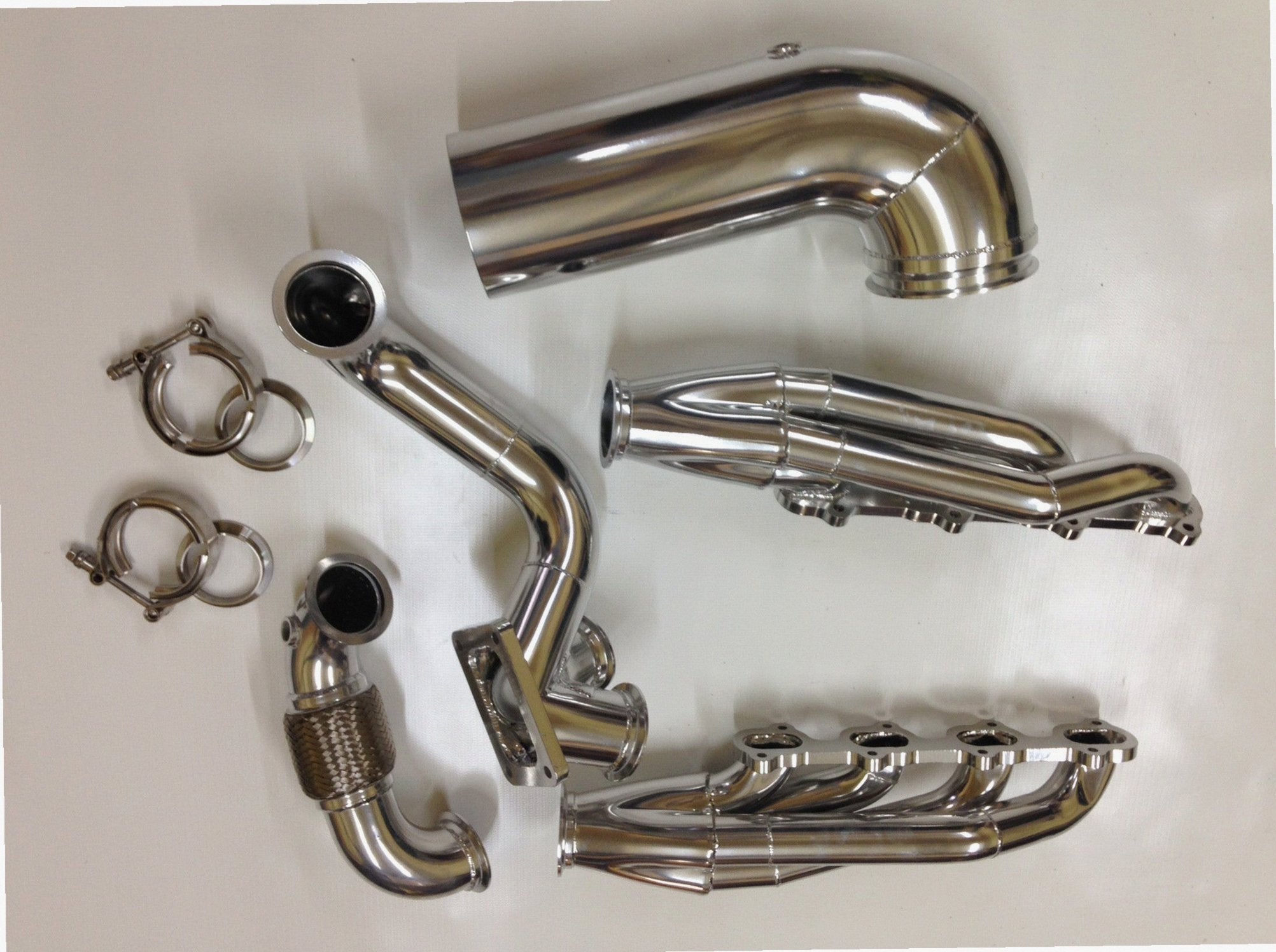 5.4 4V Turbo Street / Drag Kit — detail view of merge collector, flex bellow joint, and V-band connection