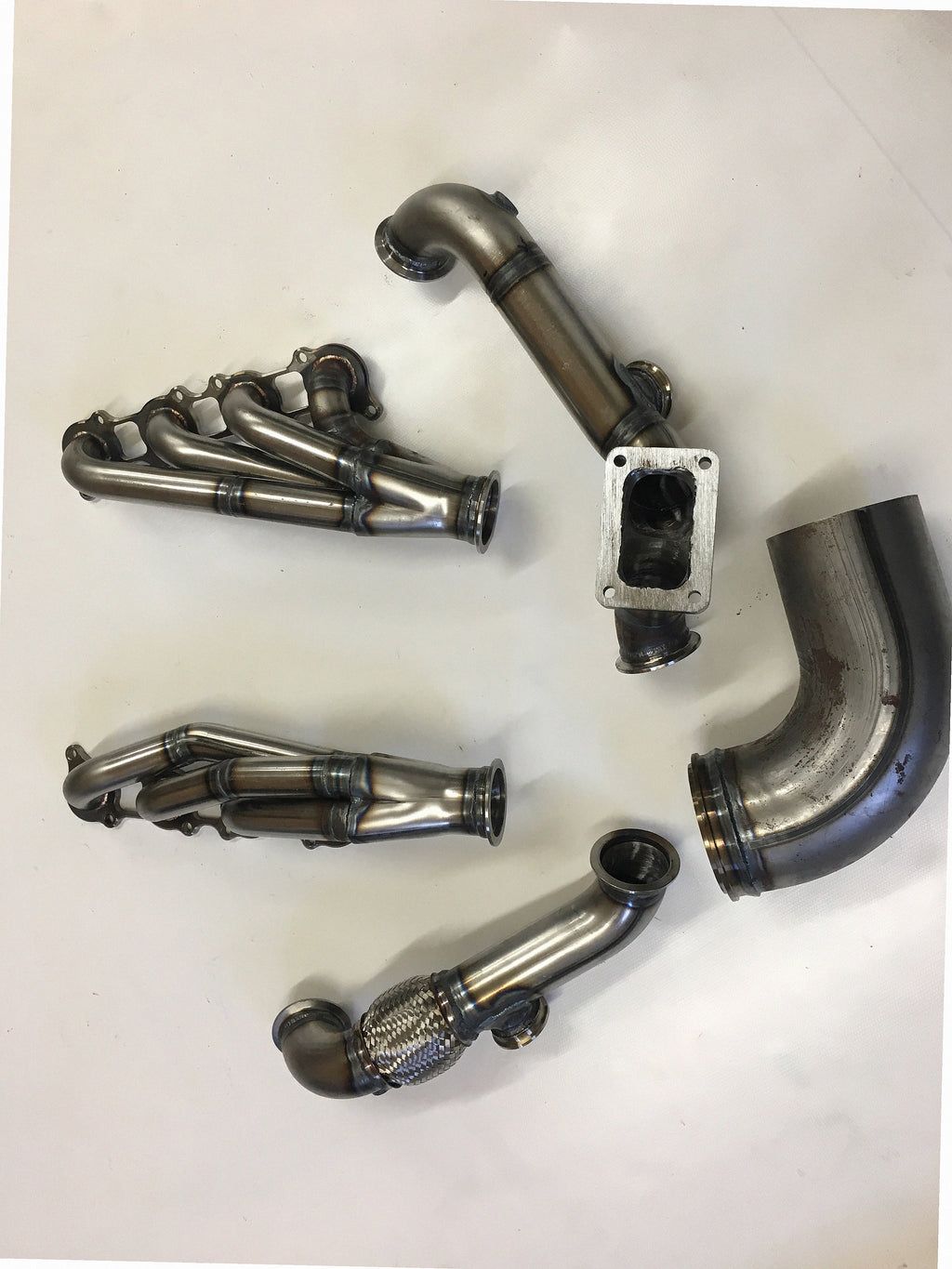 5.0 Coyote 10-14 TO6 Turbo Race Kit — passenger-side header with V-band flange and merge collector