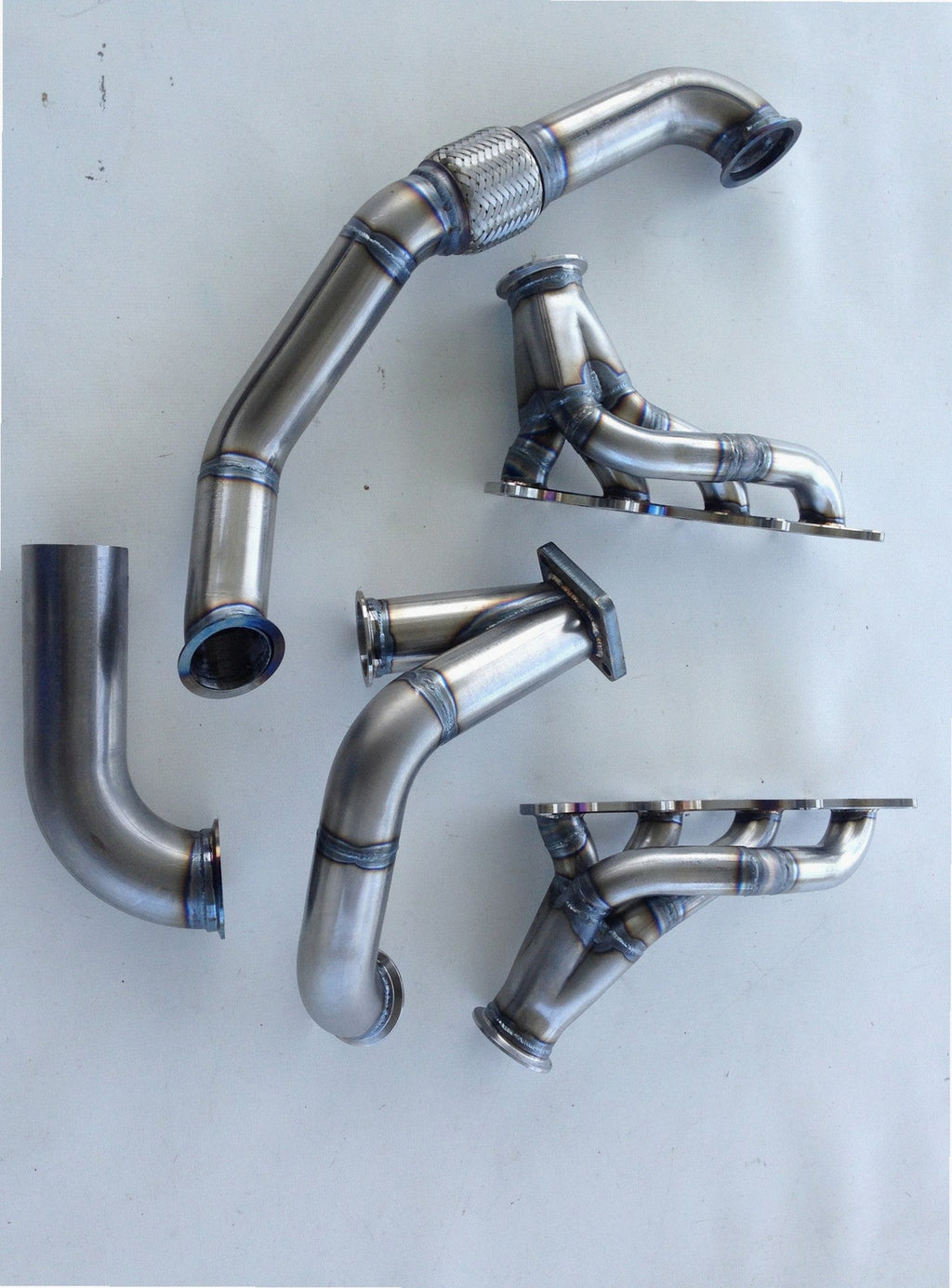 Coyote Turbo Swap Driver Side Street/Drag Kit — complete turbo hot-side kit with mild steel tubular headers, crossover pipe with flex bellow, starter downpipe, and turbo mount flange