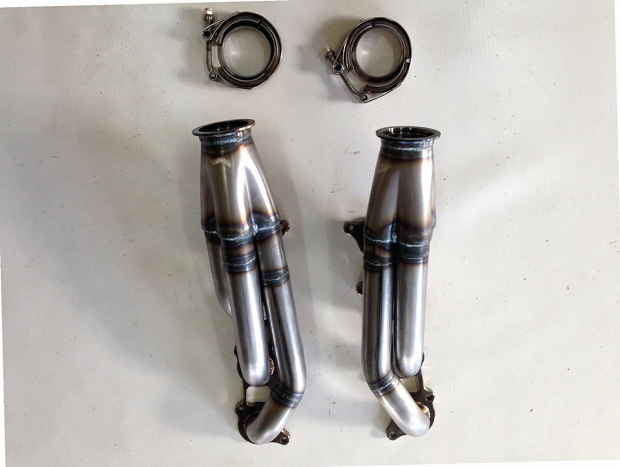 5.0 Coyote Racing Headers — detail view of merge collector, flex bellow joint, and V-band connection
