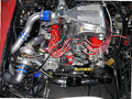 5.0 Mustang Turbo Kit — complete turbo hot-side kit with mild steel tubular headers, crossover pipe with flex bellow, starter downpipe, and turbo mount flange