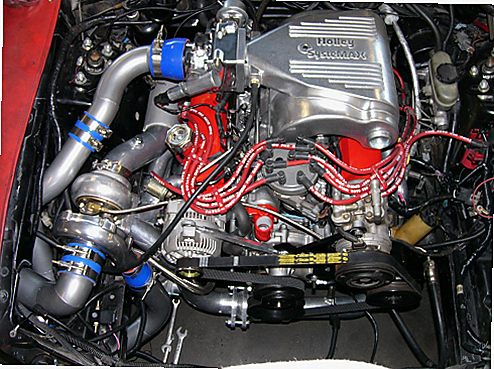 5.0 Mustang Turbo Kit — complete turbo hot-side kit with mild steel tubular headers, crossover pipe with flex bellow, starter downpipe, and turbo mount flange