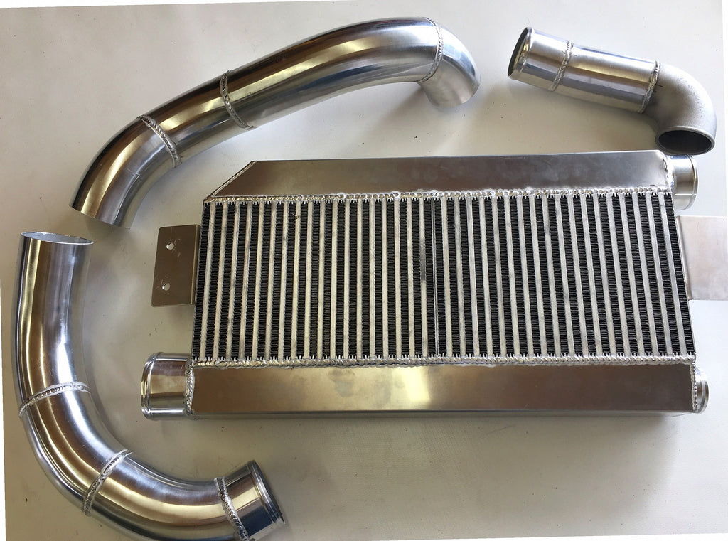 5.0 Coyote Single TO6 Turbo 15-18 Intercooler Kit — intercooler core detail showing bar-and-plate fin density and TIG-welded seams