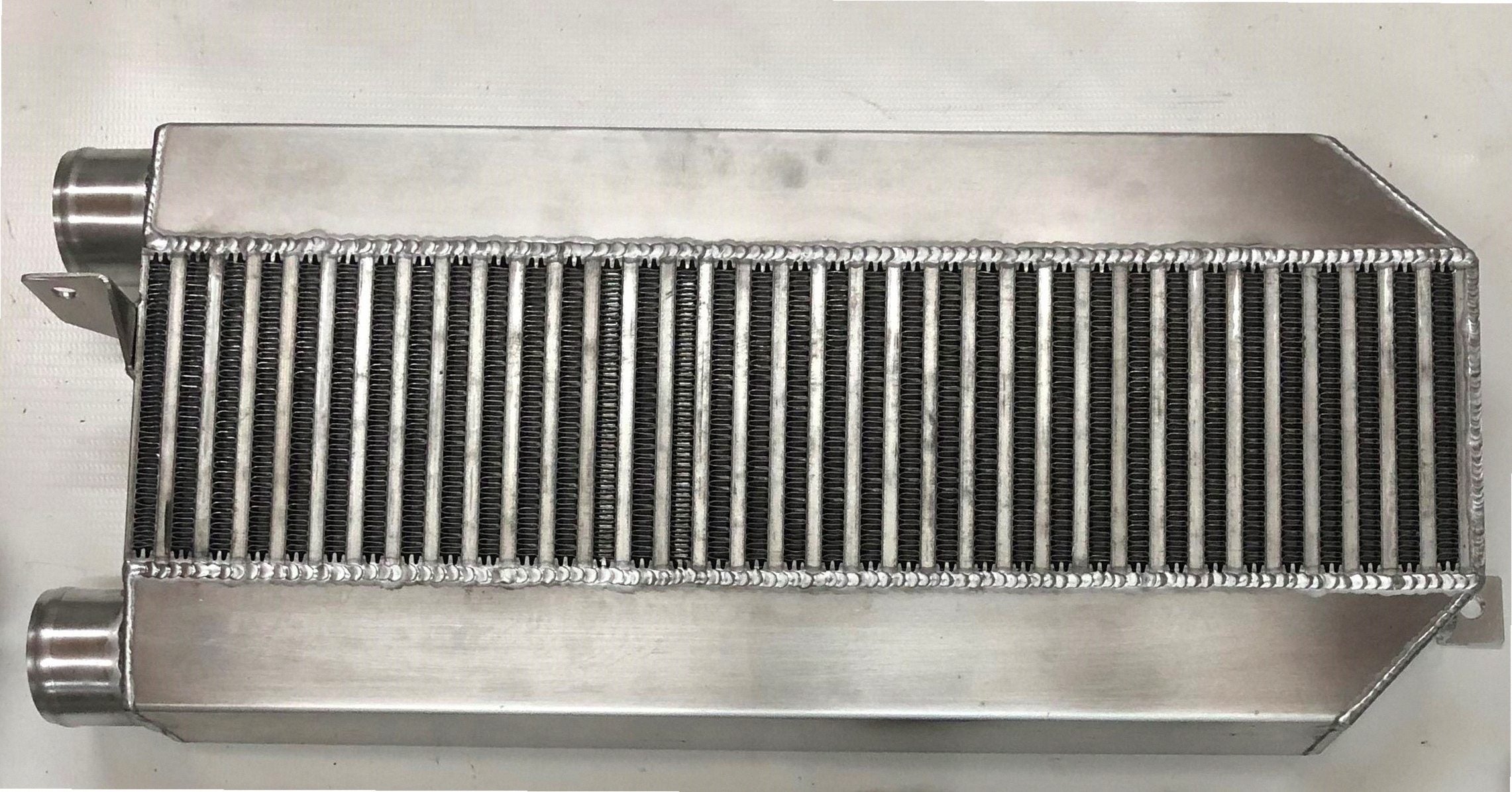 94/95 Turbo Intercooler 3 1/2" — fabricated aluminum bar-and-plate intercooler core with TIG-welded end tanks