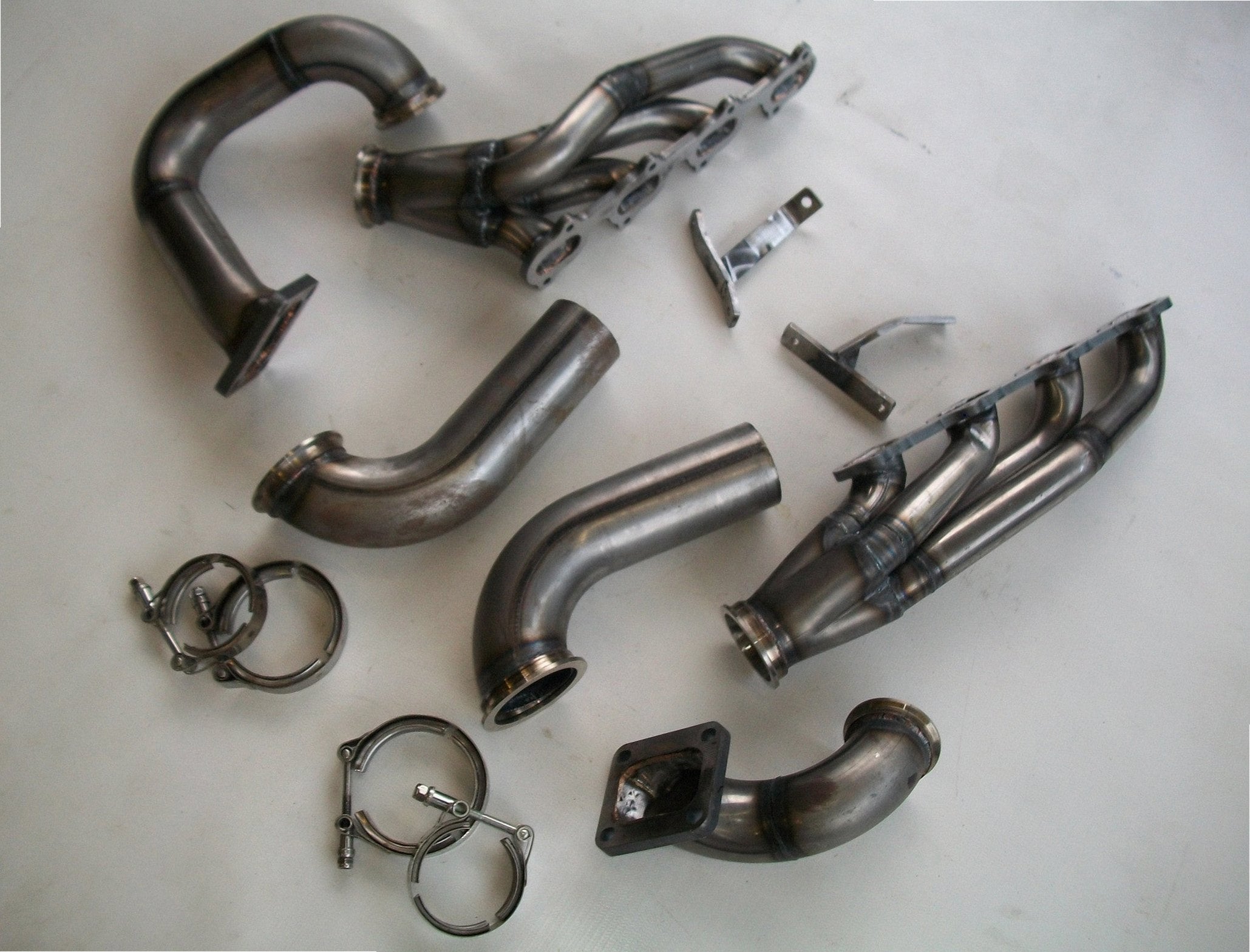 4.6 4V Twin Turbo Hotside — detail view of merge collector, flex bellow joint, and V-band connection