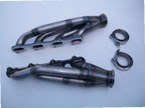 4.6 2V Racing Headers — facing-forward tubular turbo headers in mild steel with V-band flanges and CNC head flanges