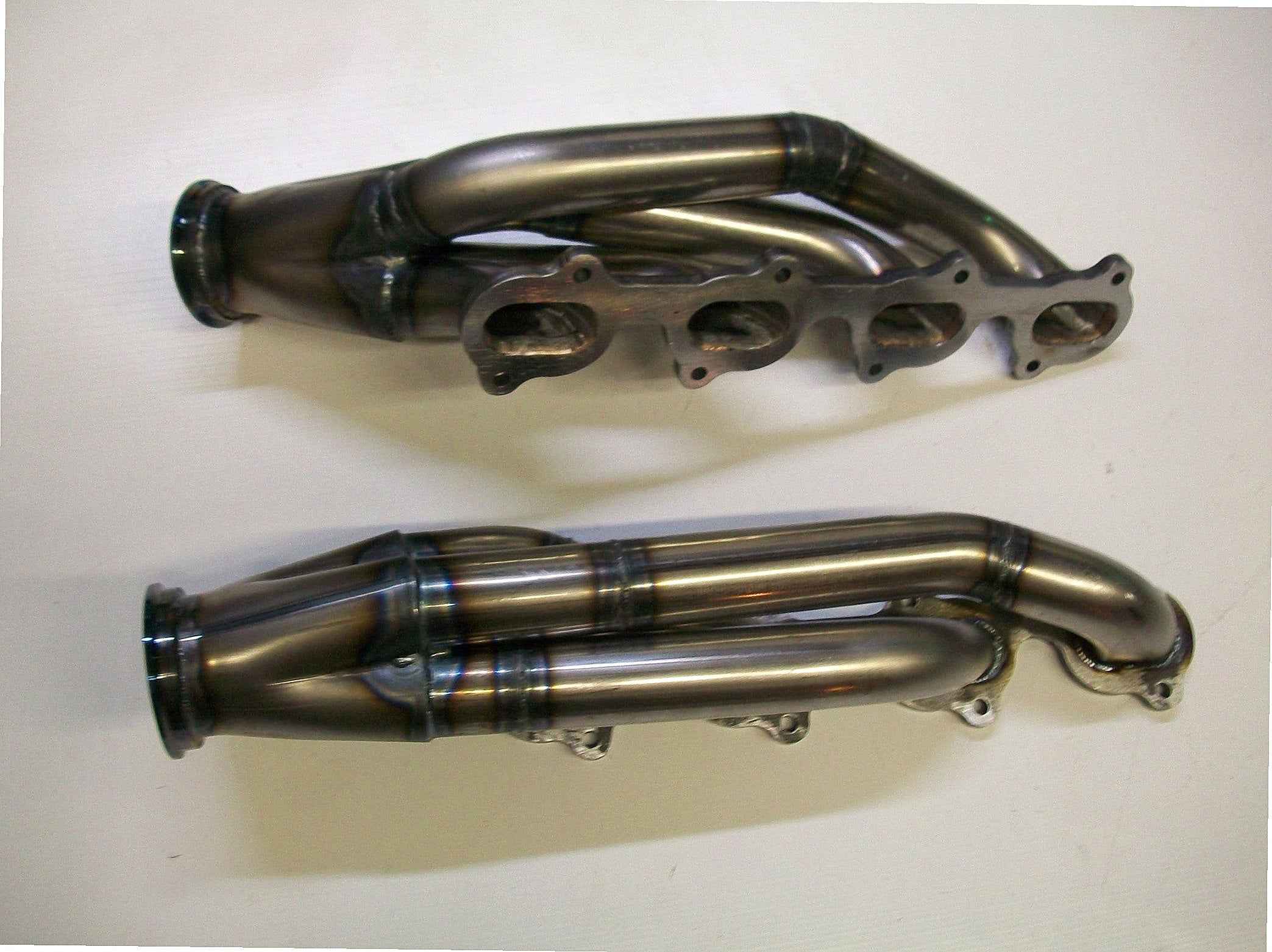 4.6 4V Turbo Headers A/C Delete Pulley — detail view of merge collector, flex bellow joint, and V-band connection