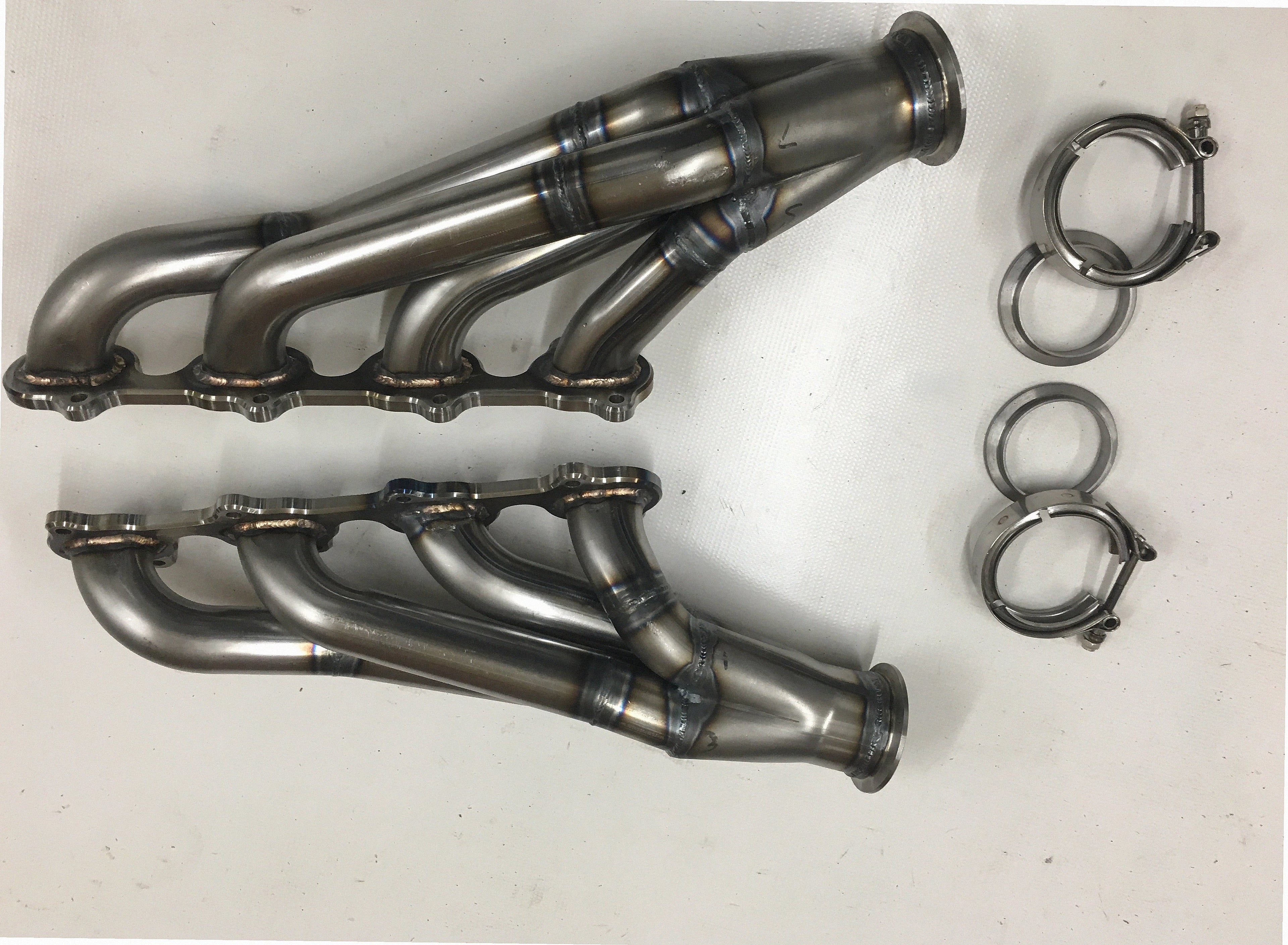 4.6 2V Motor Plate Headers — facing-forward tubular turbo headers in mild steel with V-band flanges and CNC head flanges