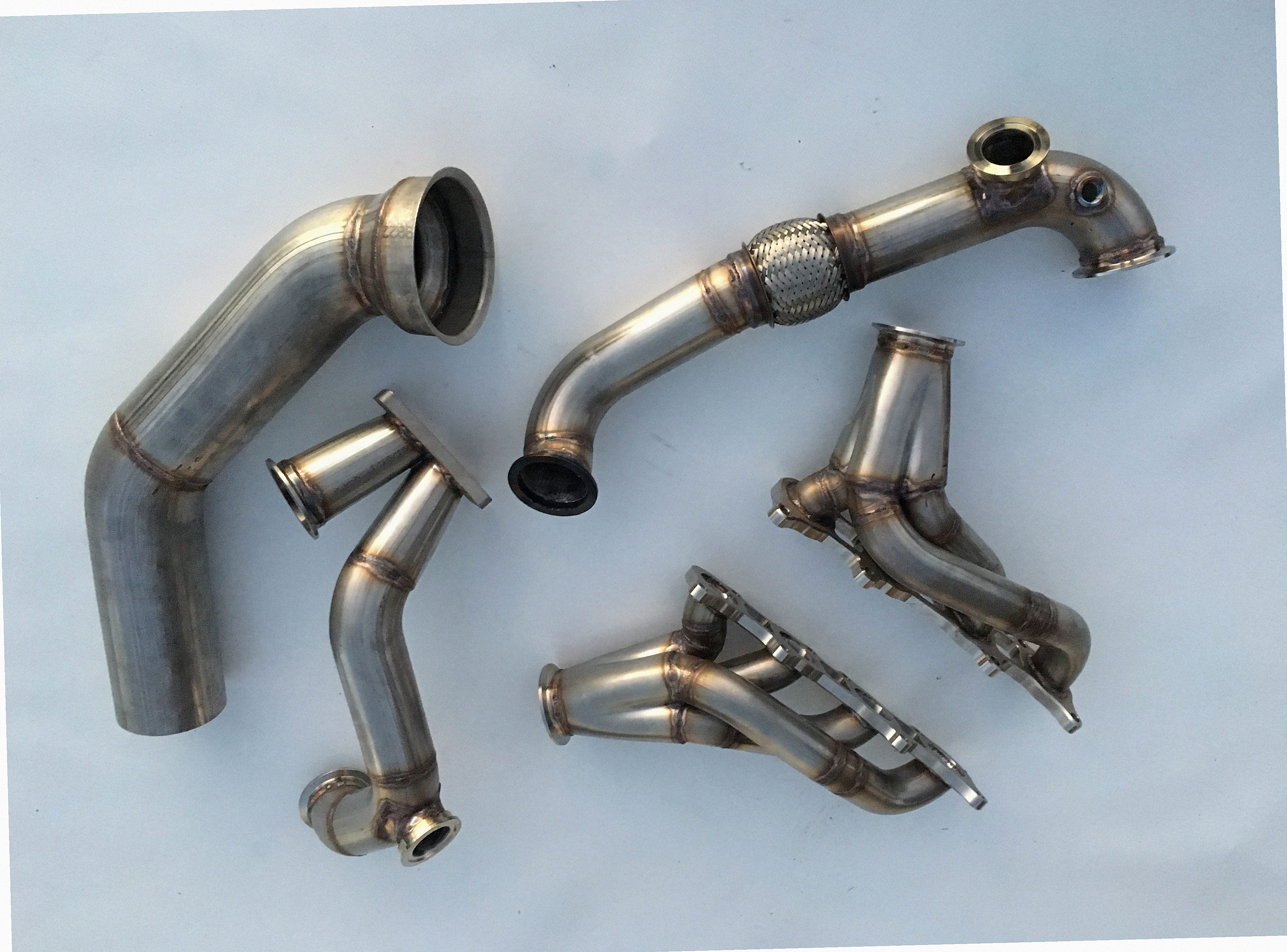 Coyote Swap TO6 Turbo Race Kit — complete turbo hot-side kit with mild steel tubular headers, crossover pipe with flex bellow, starter downpipe, and turbo mount flange