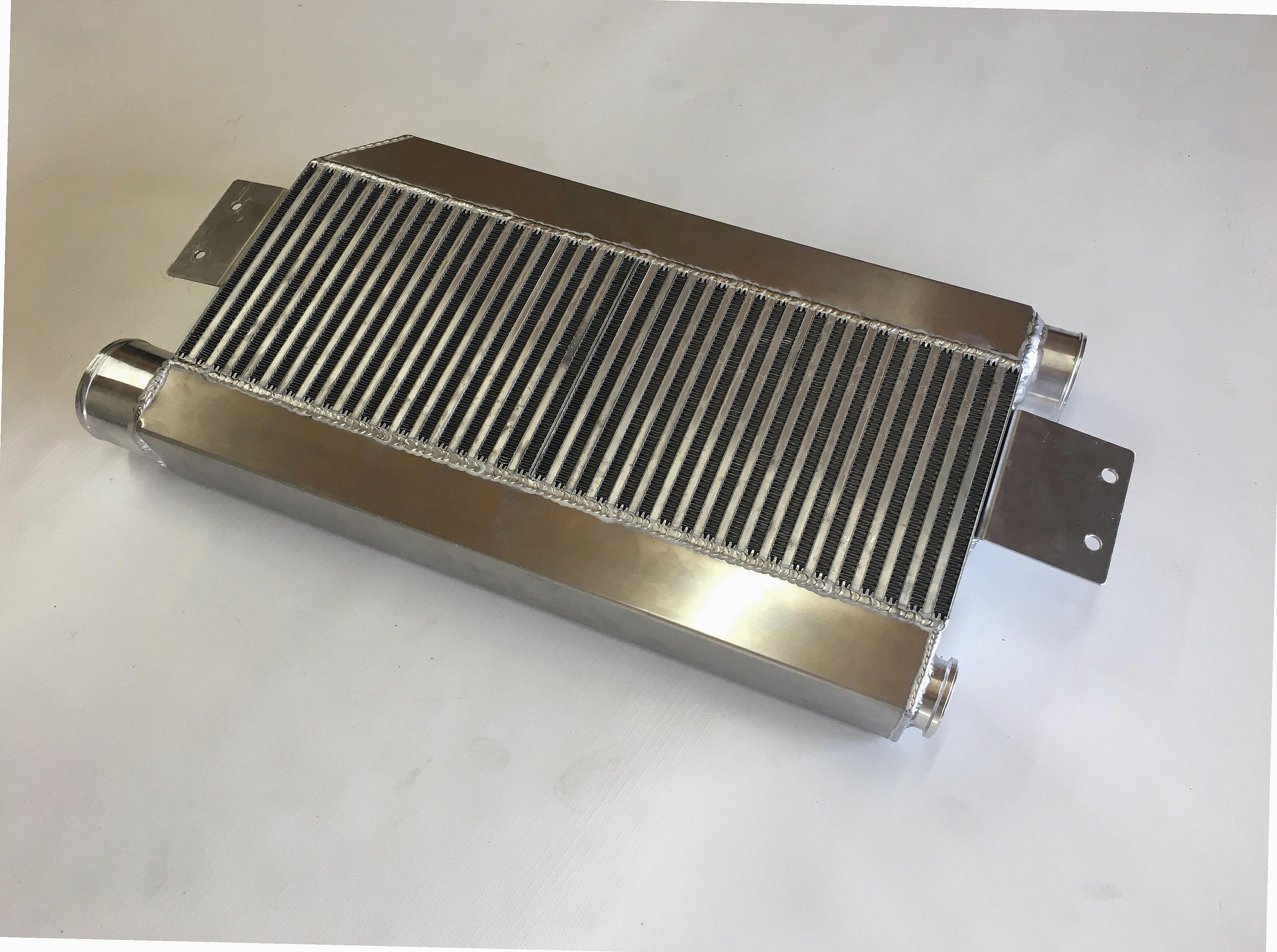 5.0 Coyote Single TO4 Turbo 15-18 Intercooler Kit — intercooler core detail showing bar-and-plate fin density and TIG-welded seams