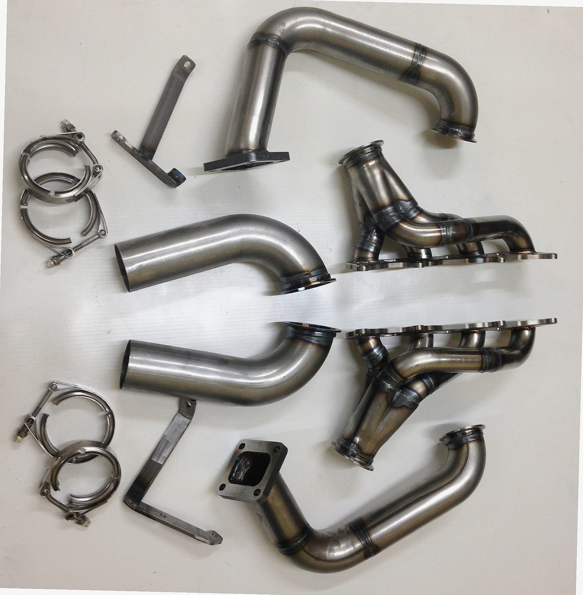 Coyote Swap / Twin Turbo Hotside — detail view of merge collector, flex bellow joint, and V-band connection