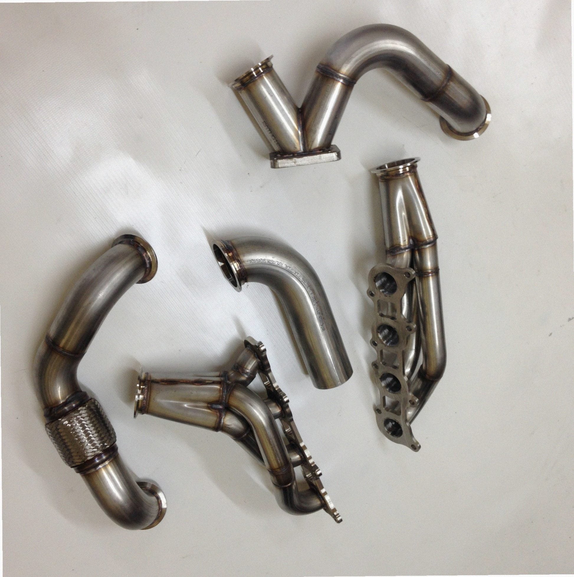 Coyote Swap Drag Kit — detail of crossover pipe, flex bellow, or starter downpipe