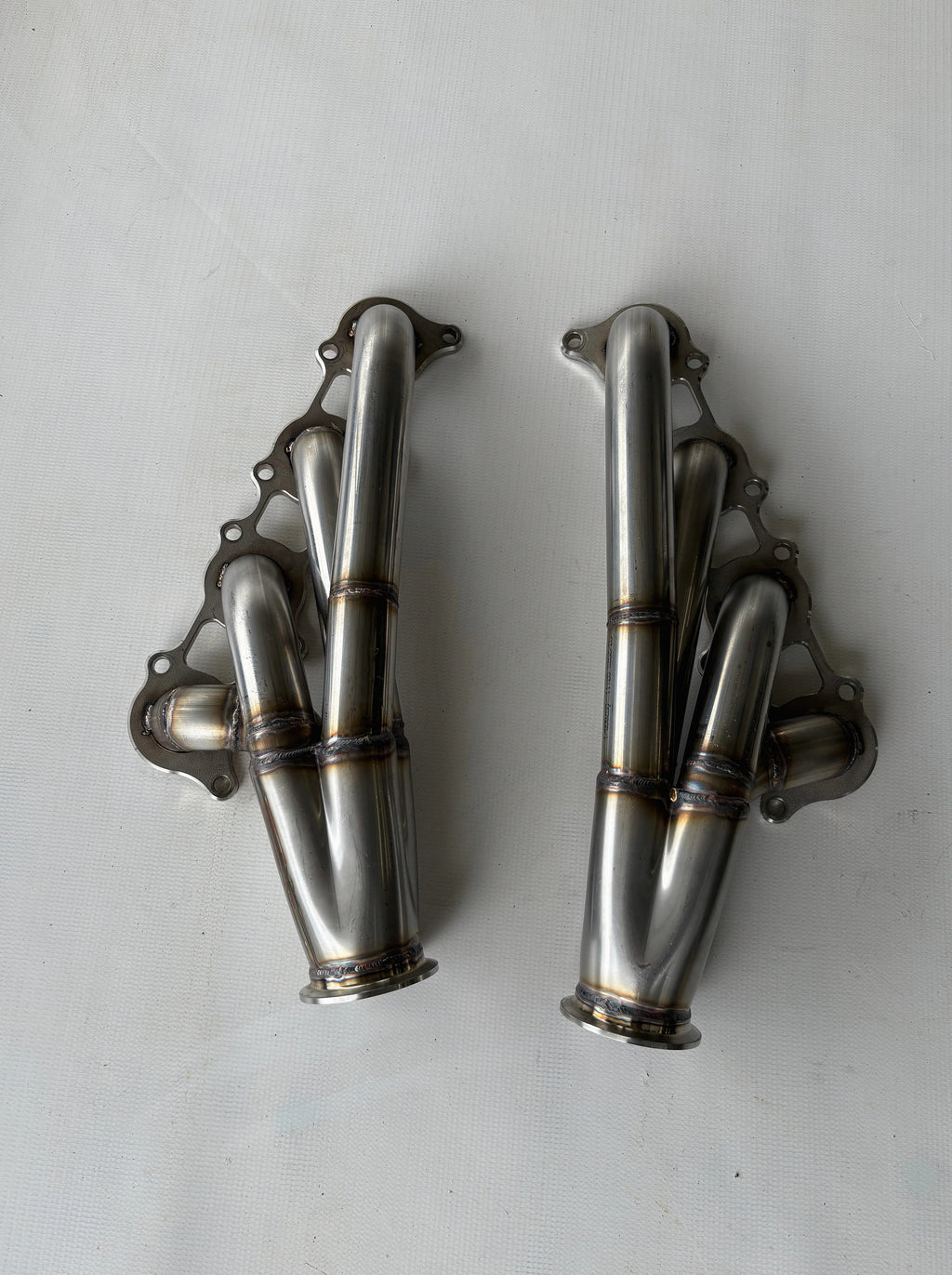 Coyote Swap Turbo Headers Up — complete turbo hot-side kit with mild steel tubular headers, crossover pipe with flex bellow, starter downpipe, and turbo mount flange