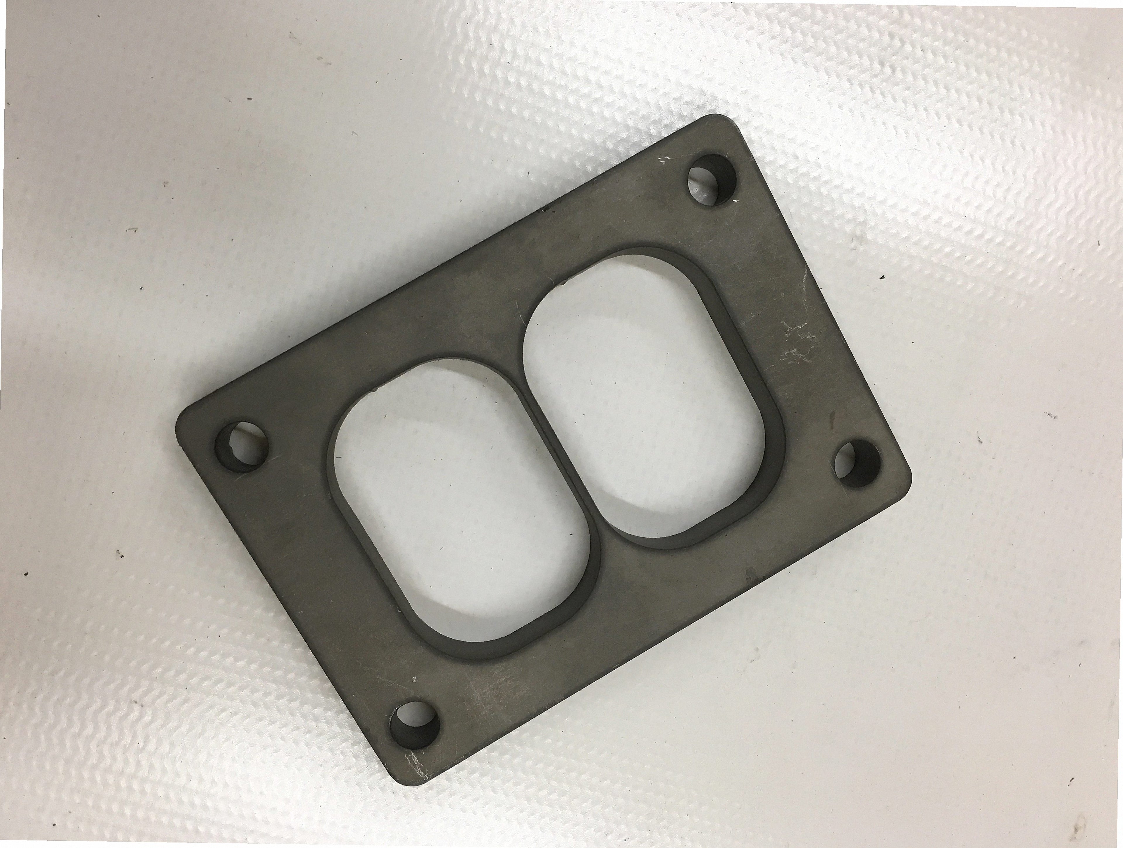 TO6 Divided Flange — CNC-machined stainless steel turbine inlet flange, multi-axis milled for turbocharger fitment