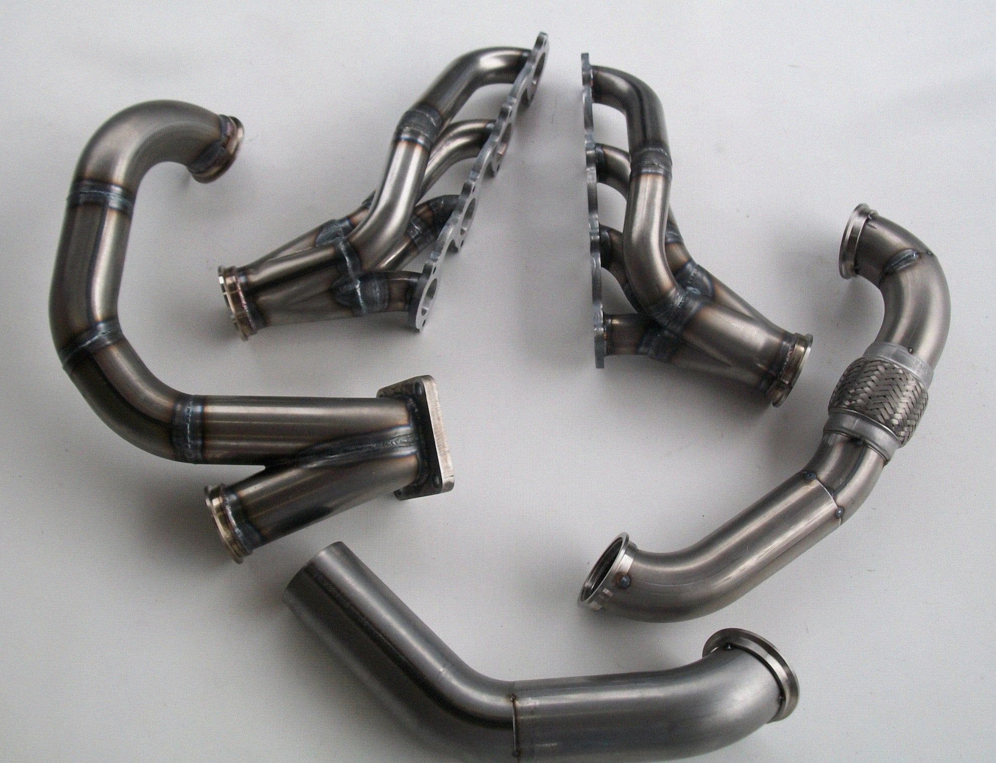4.6 2V Turbo Fox Body Race Kit — complete turbo hot-side kit with stainless steel tubular headers, crossover pipe with flex bellow, starter downpipe, and turbo mount flange