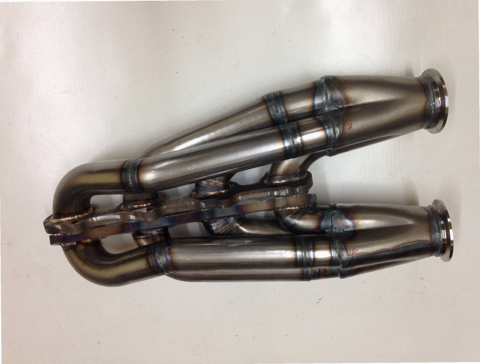 5.4 2V Facing Forward headers — passenger-side header with V-band flange and merge collector