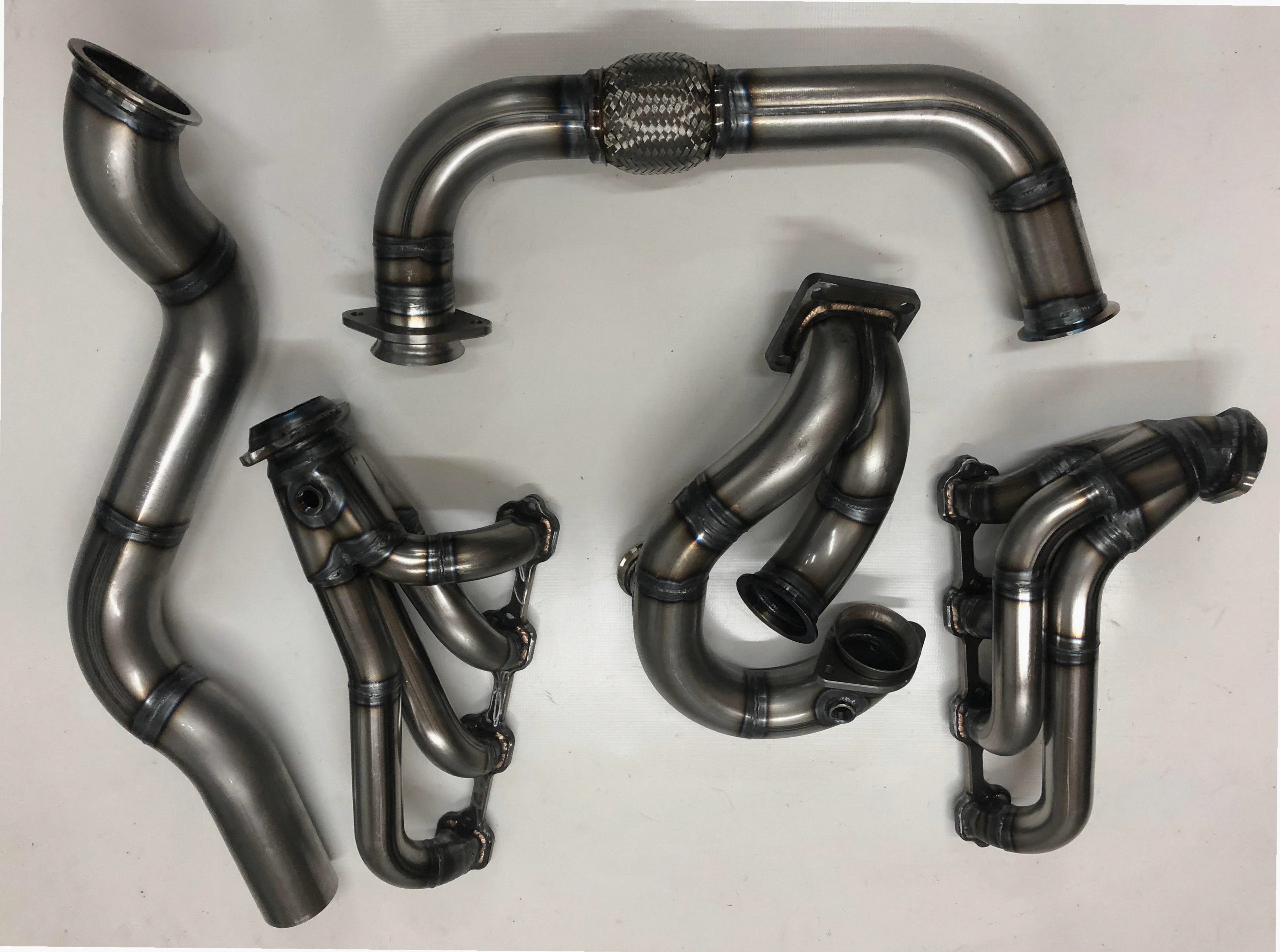 94/95 Mustang Turbo Kit — complete turbo hot-side kit with mild steel tubular headers, crossover pipe with flex bellow, starter downpipe, and turbo mount flange