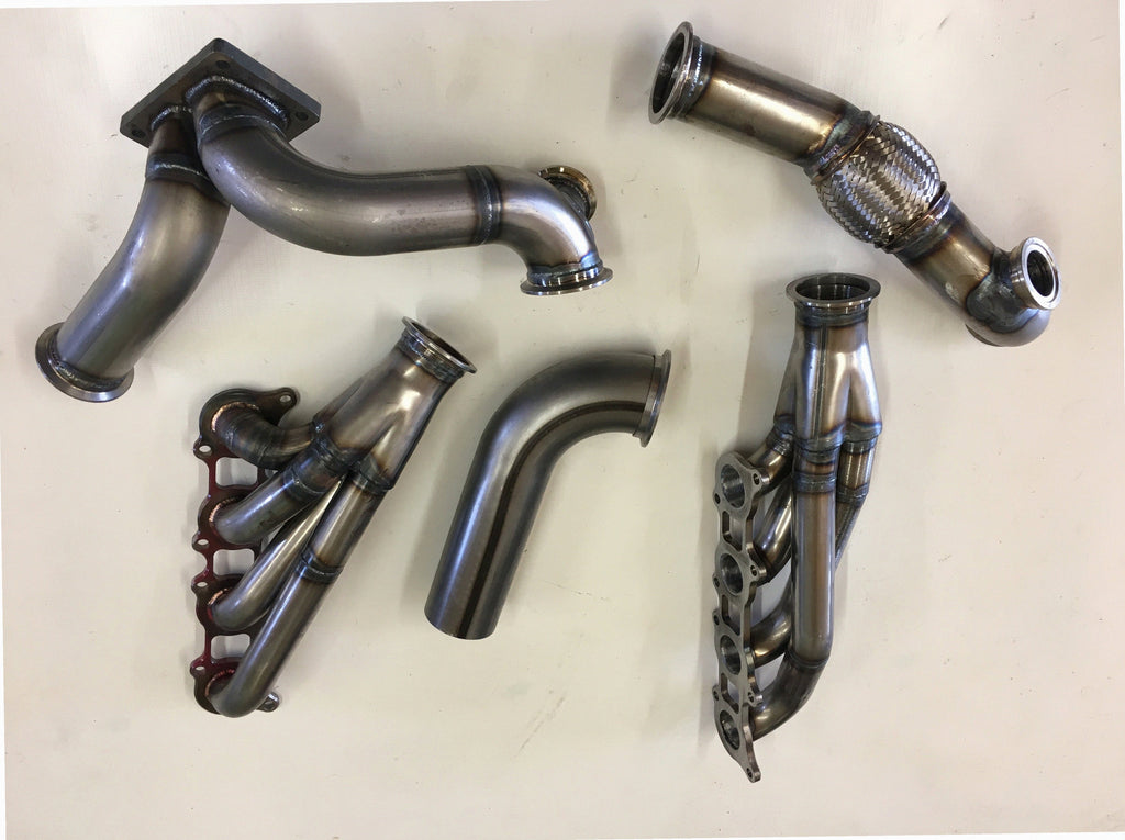 5.0 Coyote 15-18 TO4 Turbo Street/Drag Kit — complete turbo hot-side kit with mild steel tubular headers, crossover pipe with flex bellow, starter downpipe, and turbo mount flange