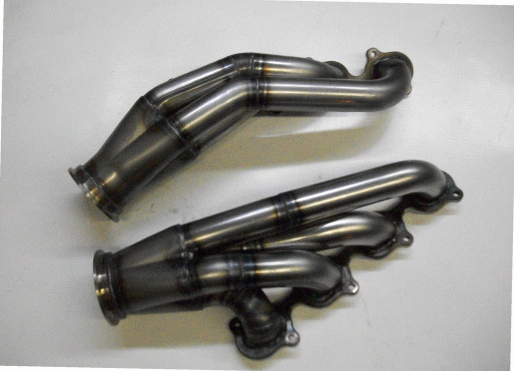 GT500 Turbo Headers — detail view of merge collector, flex bellow joint, and V-band connection