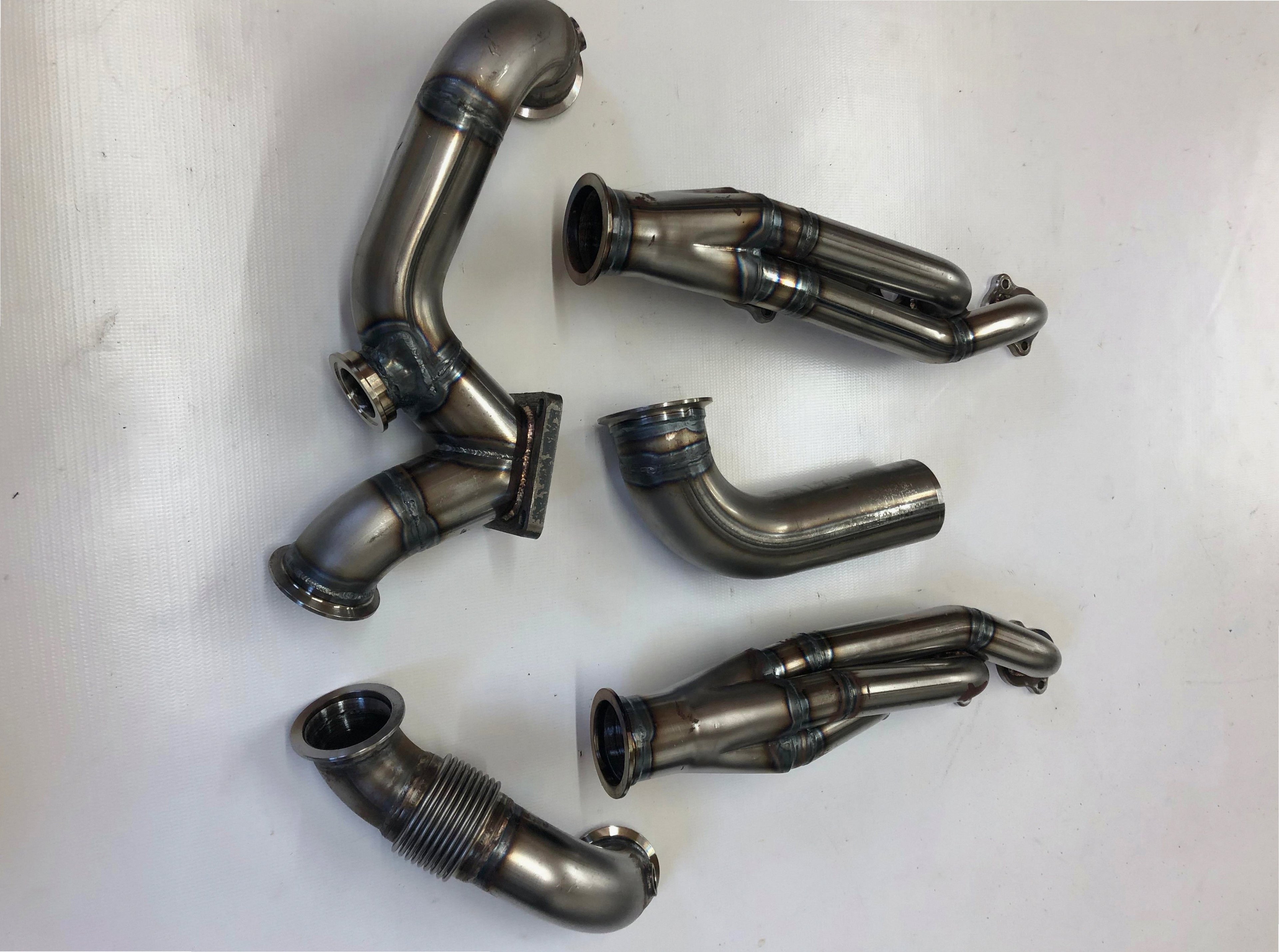 5.4 4V Turbo Street / Drag Kit A/C Delete — passenger-side header with V-band flange and merge collector