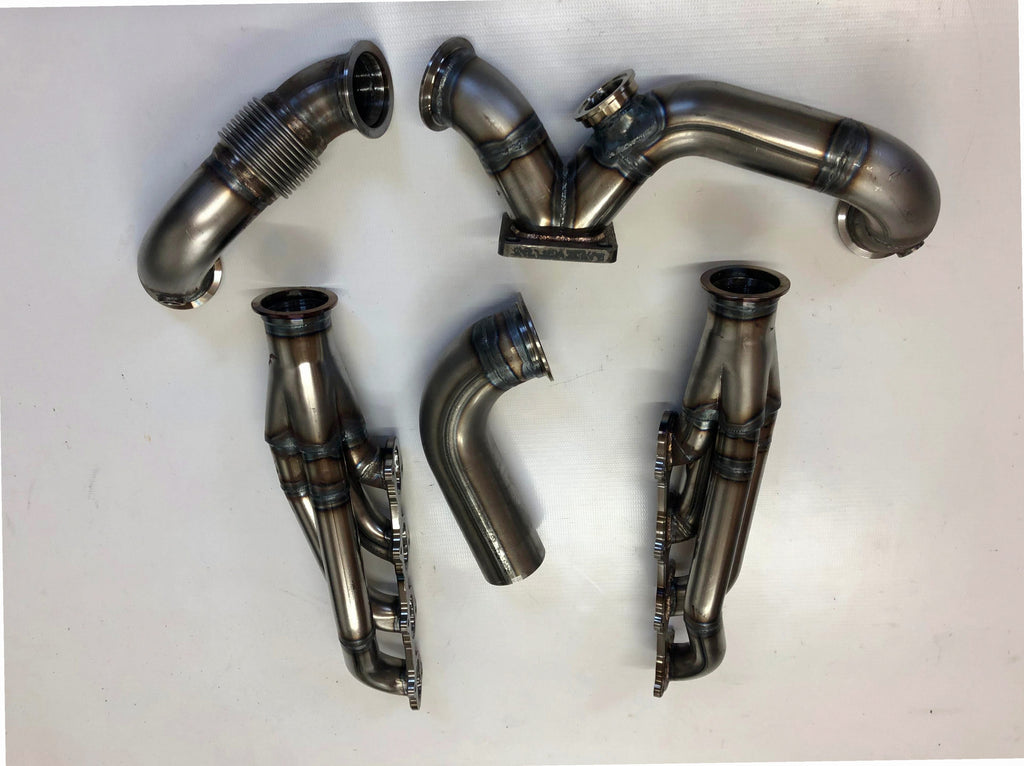 5.4 4V Turbo Street / Drag Kit A/C Delete — complete turbo hot-side kit with mild steel tubular headers, crossover pipe with flex bellow, starter downpipe, and turbo mount flange