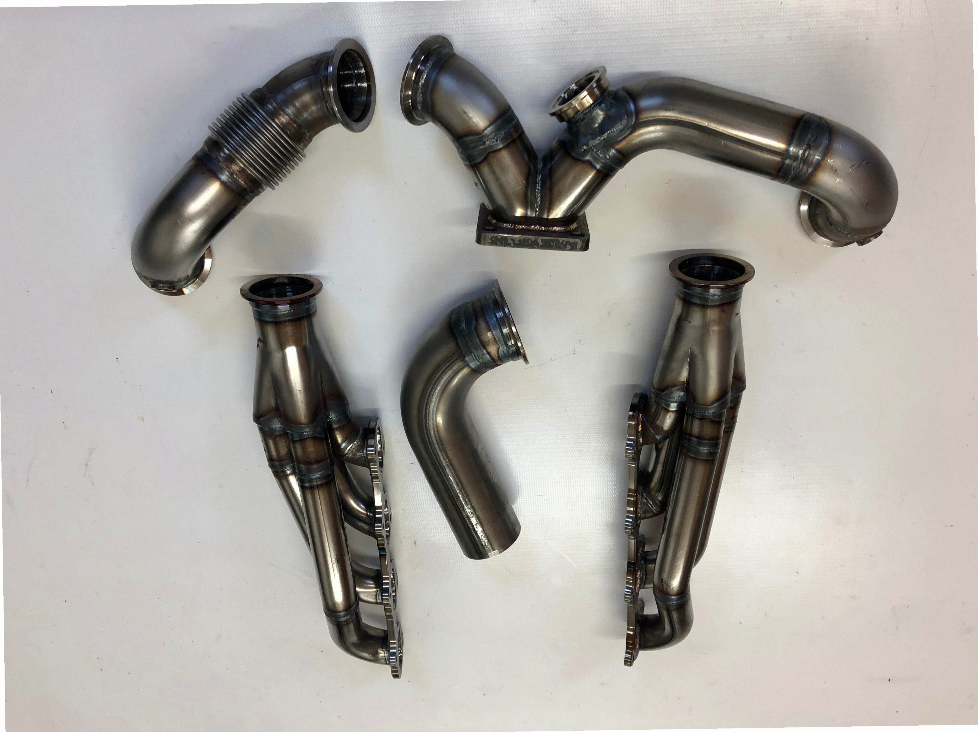 5.4 4V Turbo Street / Drag Kit A/C Delete — complete turbo hot-side kit with mild steel tubular headers, crossover pipe with flex bellow, starter downpipe, and turbo mount flange