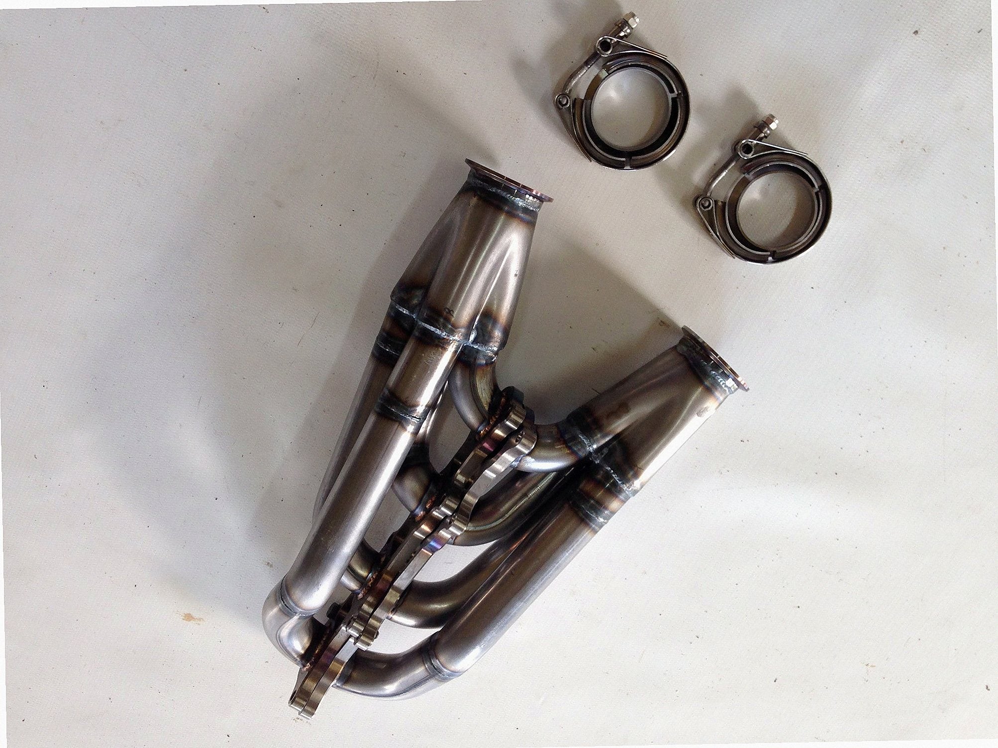 Coyote Swap Racing Headers — detail view of merge collector, flex bellow joint, and V-band connection