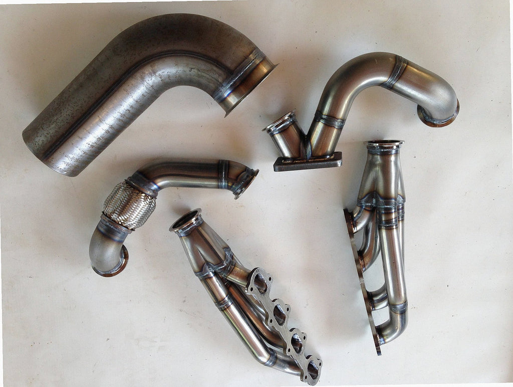 Modular 2V TO6 Turbo Race Kit — complete turbo hot-side kit with mild steel tubular headers, crossover pipe with flex bellow, starter downpipe, and turbo mount flange