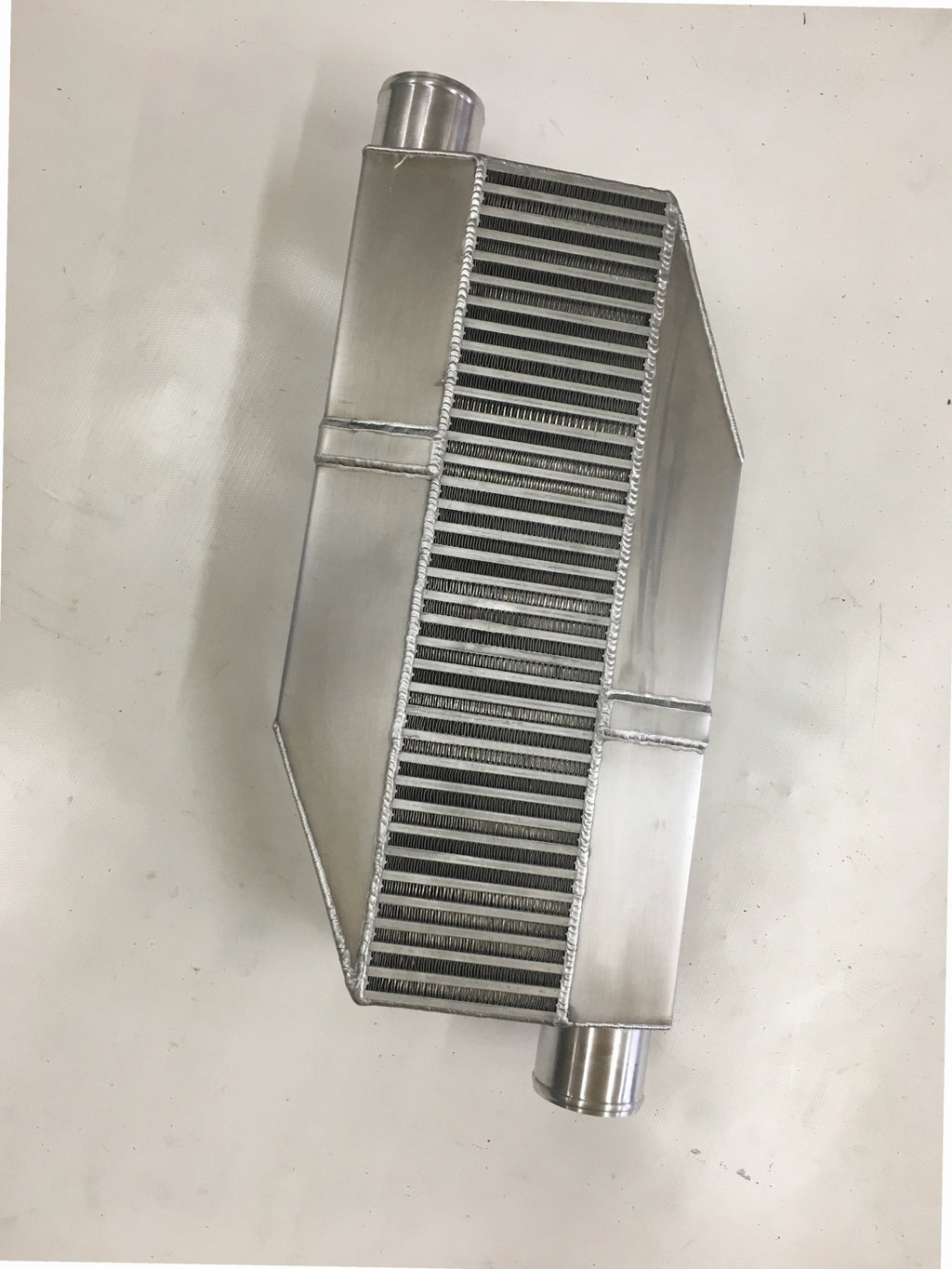 Single Turbo Intercooler 1800 HP — intercooler core detail showing bar-and-plate fin density and TIG-welded seams
